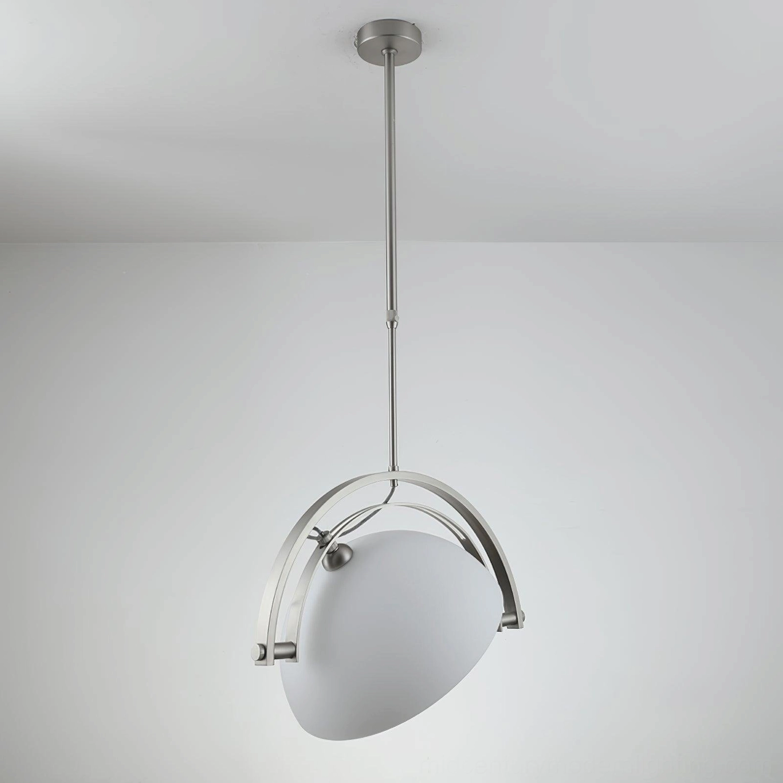 Arc pendant light installed in modern interior space showing versatile mid-century modern design language