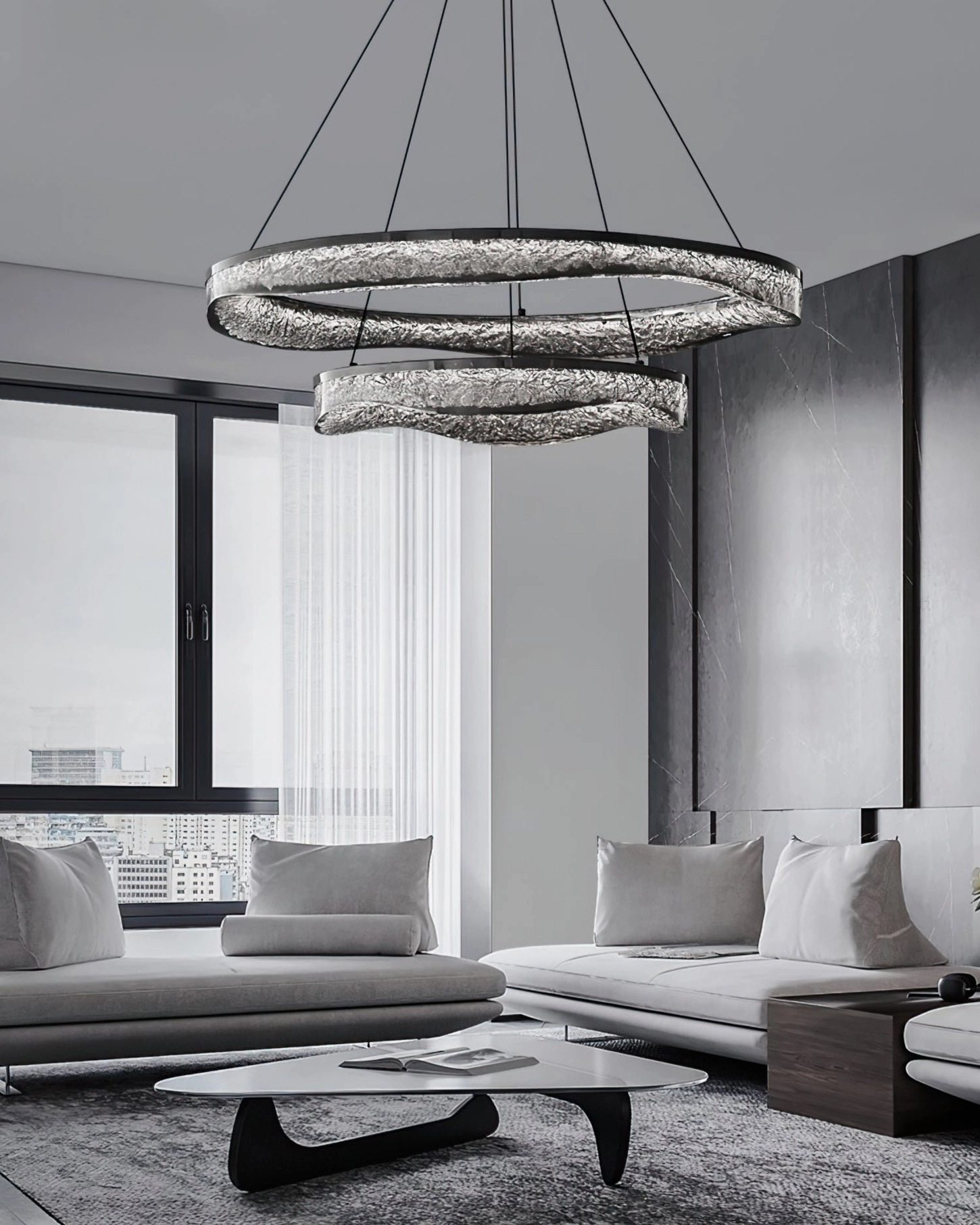 Multi-ring pendant light fixture in bright modern living room with neutral decor