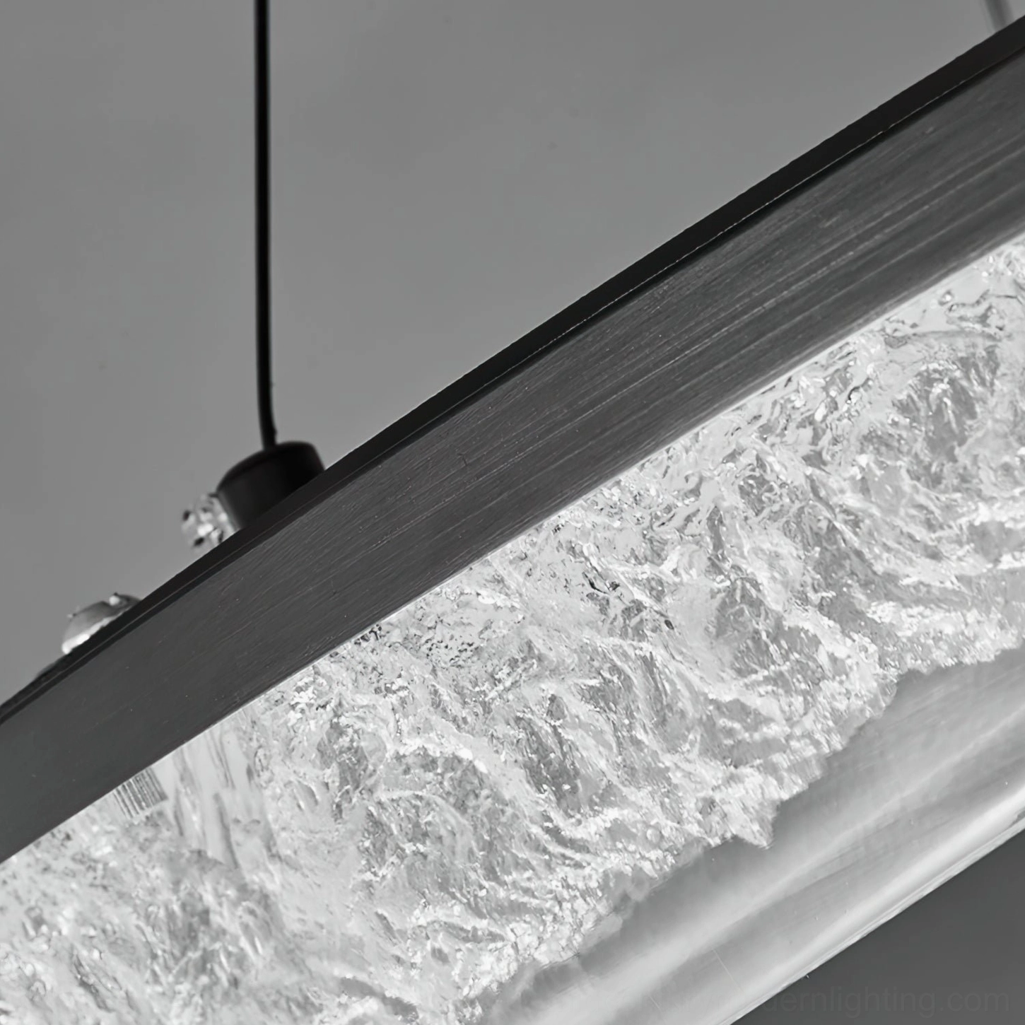 Close-up detail of textured frosted crystal resin shade with matte black metal frame
