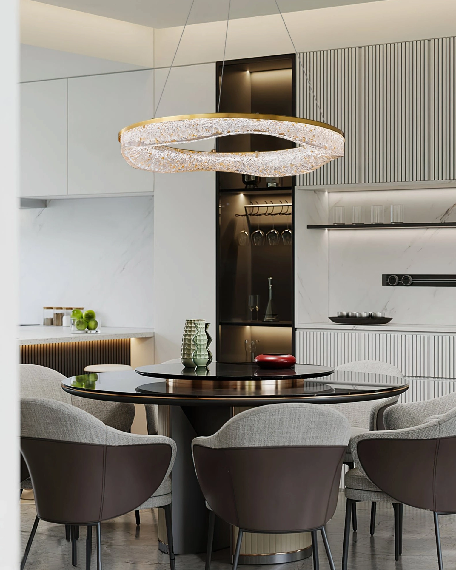 Single irregular ring pendant chandelier above modern dining table with brass accents