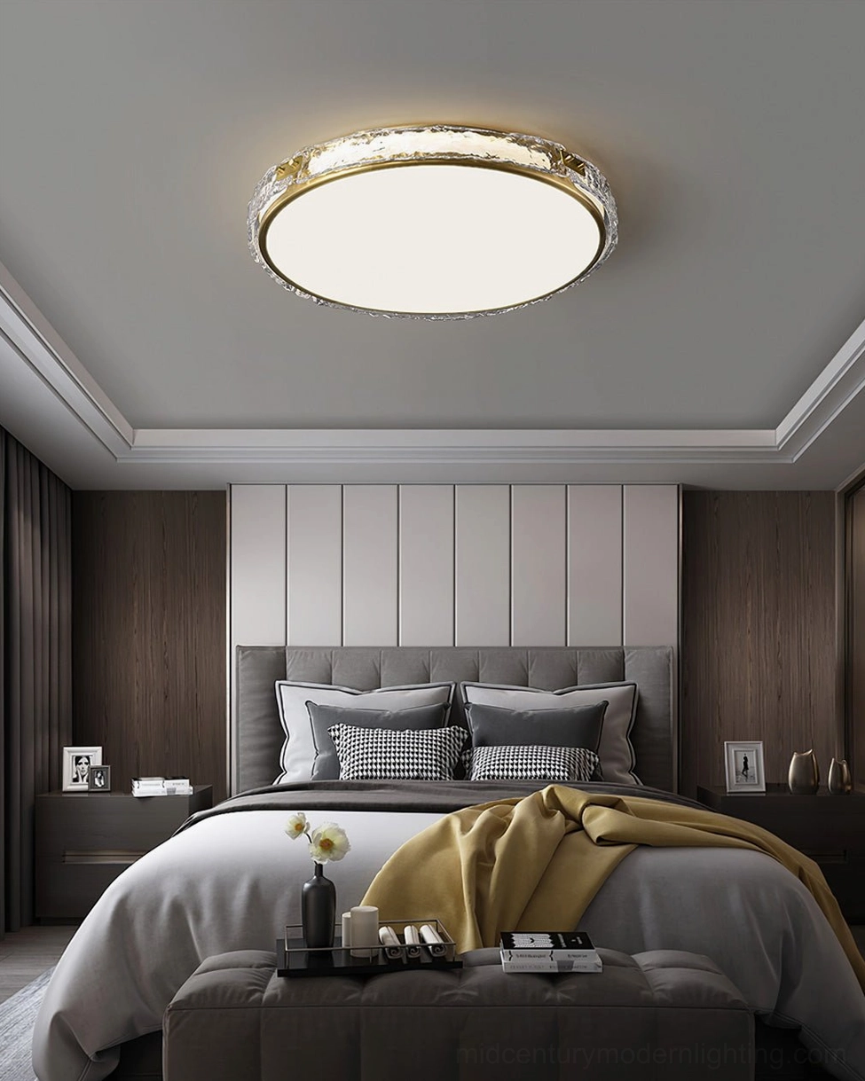 Arlus brass and glass ceiling lamp above master bedroom with padded headboard, warm neutral upscale décor