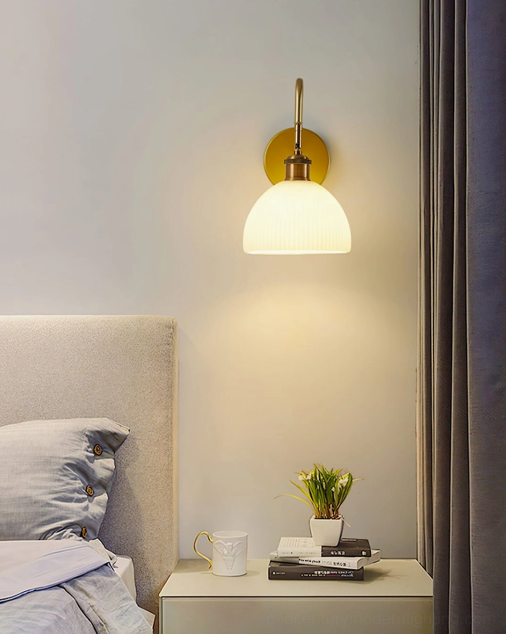 Arren bedroom wall lamp with slim brass hardware casting warm soft ambient lighting, master bedroom design
