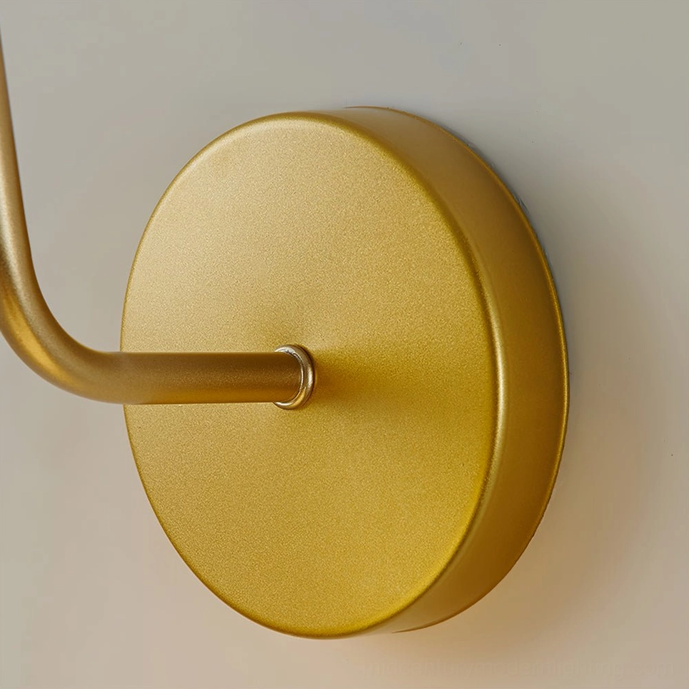 Arren brass wall sconce complete product view showcasing curved arm and sculptural design elements