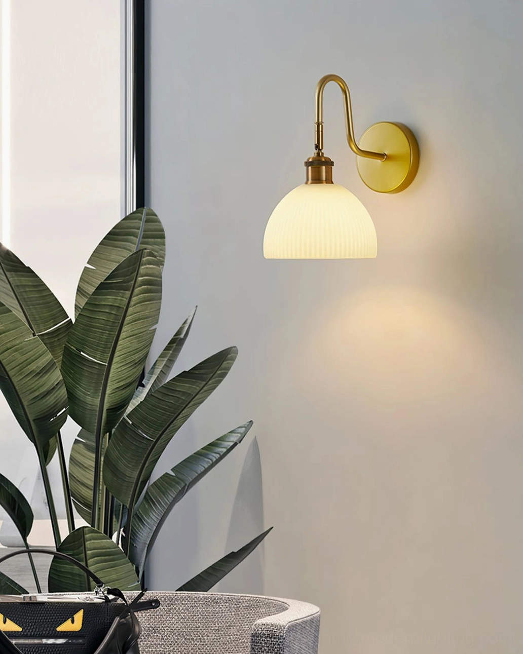 Arren wall sconce textured ribbed glass dome shade creating soft ambient light diffusion