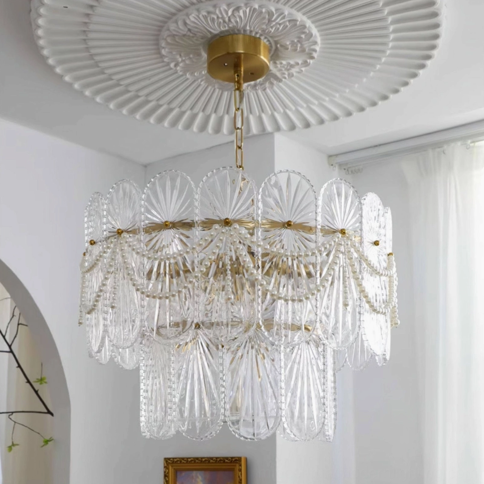 Art Deco pearl beaded glass chandelier showing warm ambient lighting and romantic glow effect