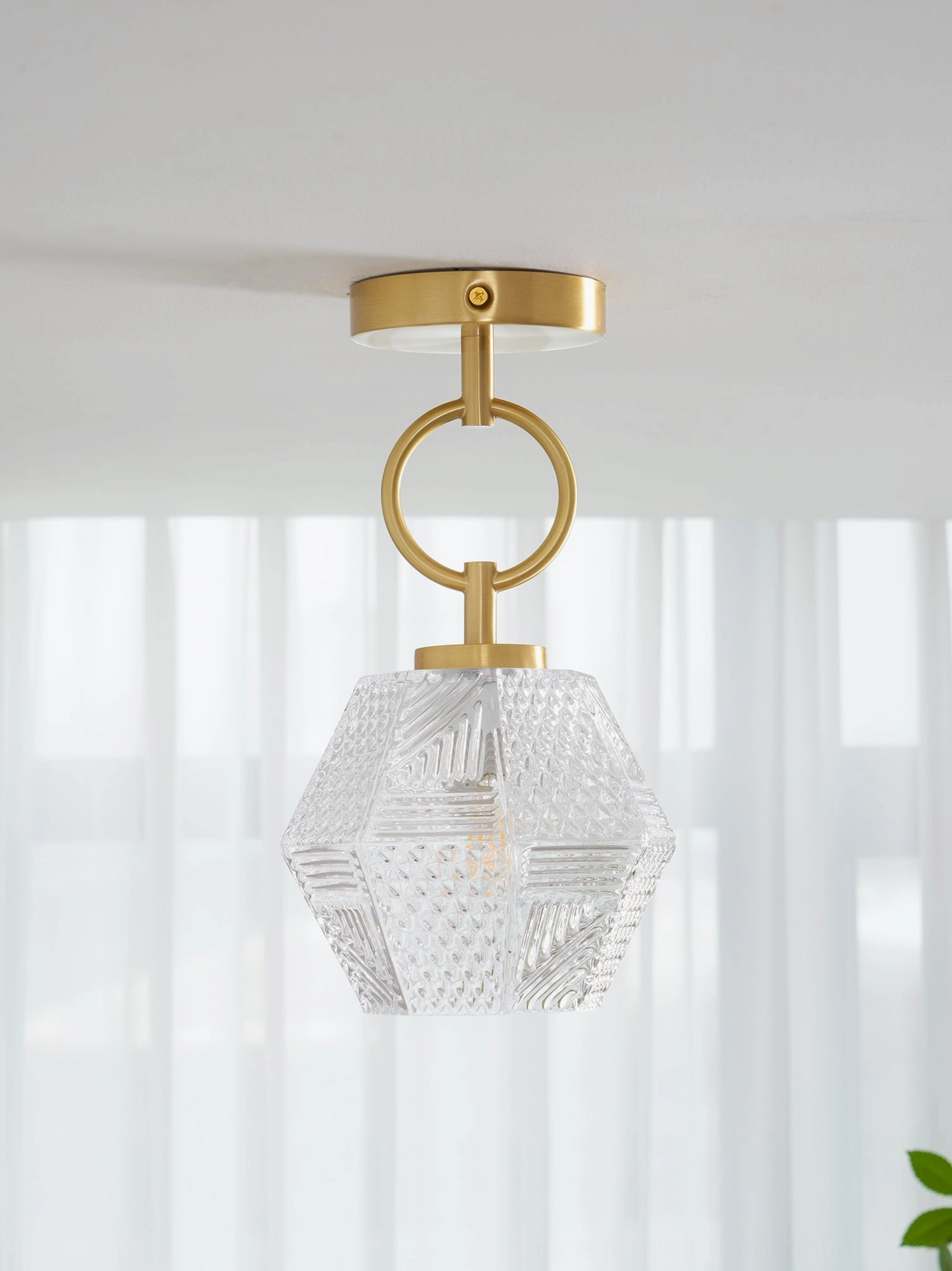 Diamond cut Art Deco light installation over dining or kitchen island spacing guide