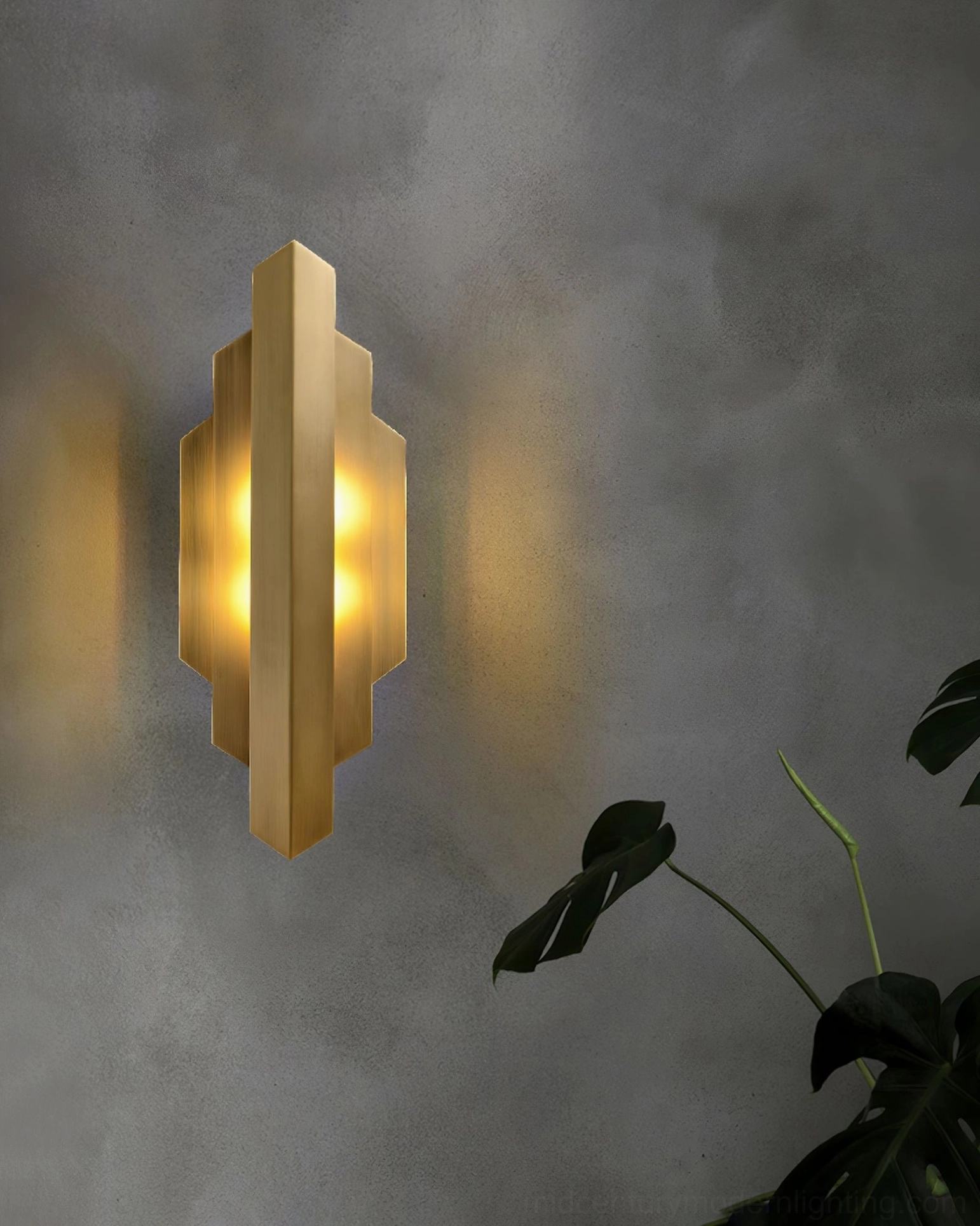 Art Deco stepped brass wall sconce showing layered metal construction and design detail