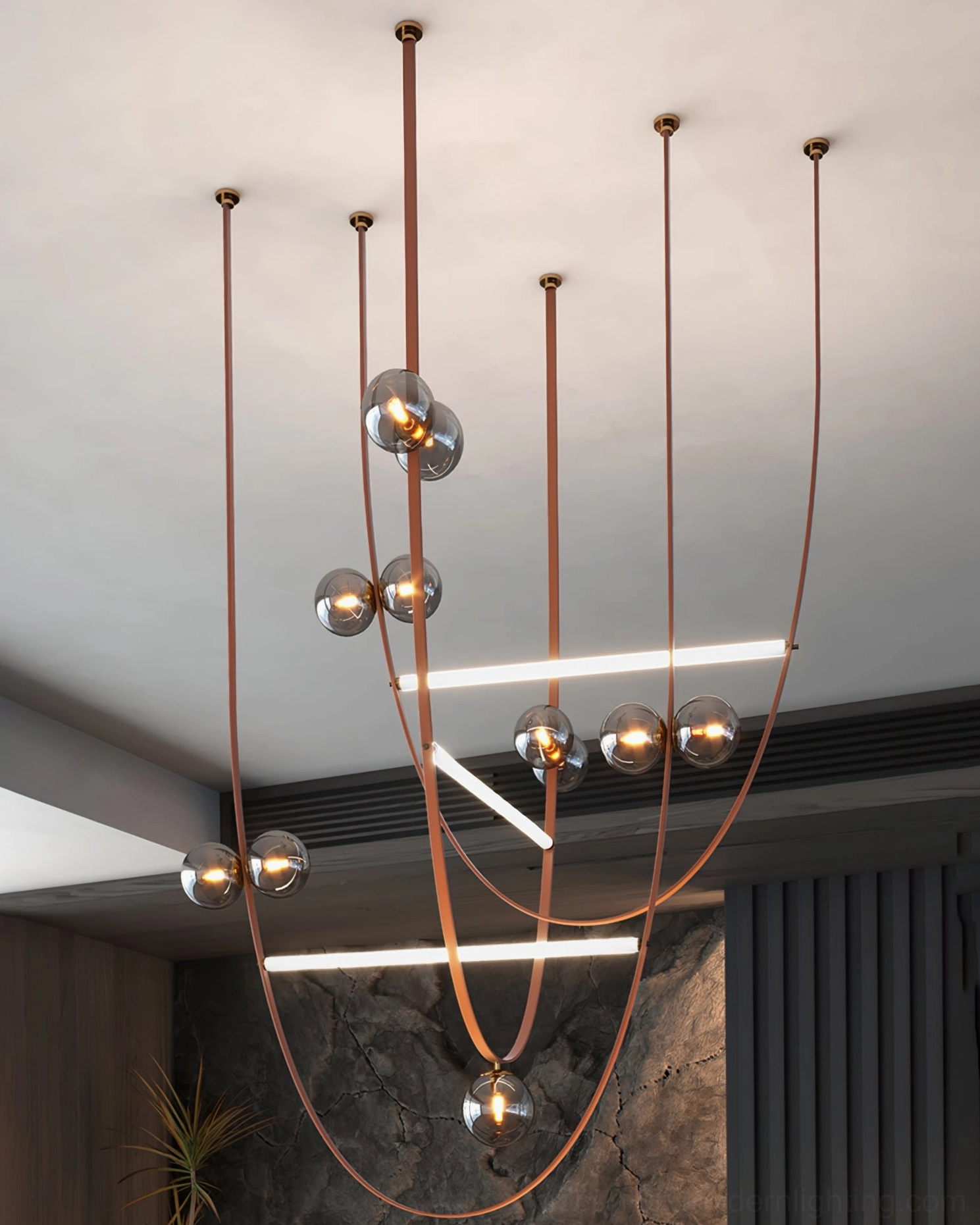 Multi-point leather strap pendant fixture overhead view in contemporary villa showing brown leather cords and multiple glass lights