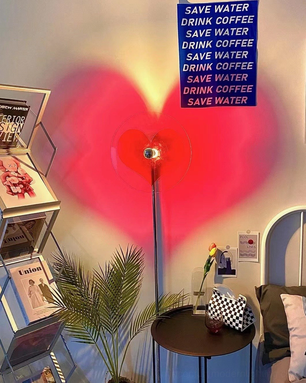 Heart-shaped floor lamp casting artistic red shadow for modern interior design and home decoration