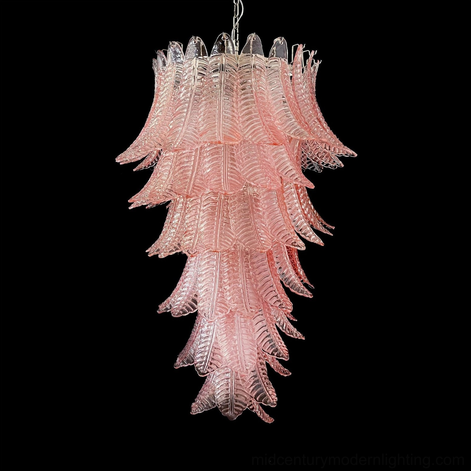Asinara light pink murano glass chandelier black background studio shot tiered palm leaf cascade