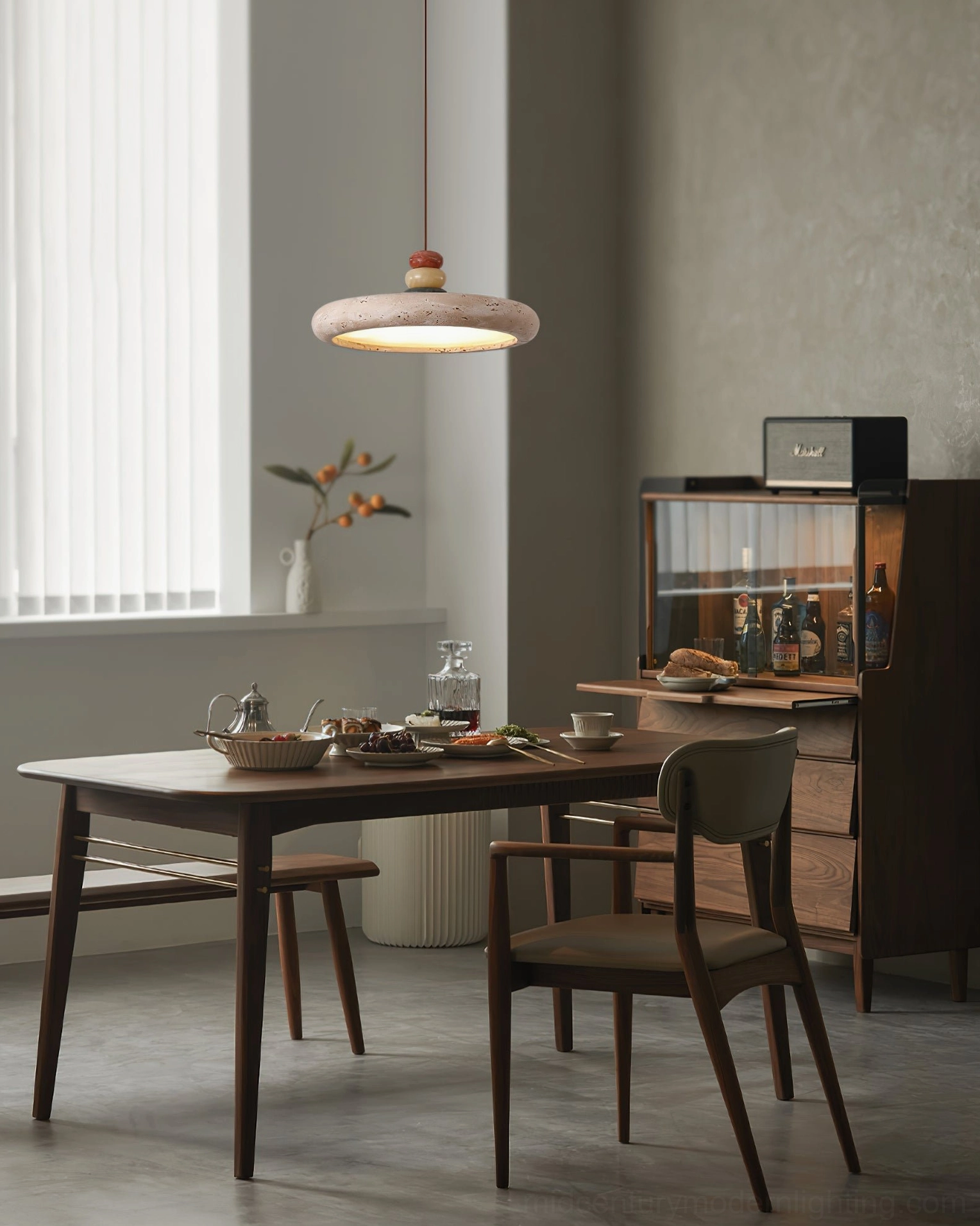 Aslo travertine pendant lamp in warm wooden interior dining room with bar cabinet backdrop