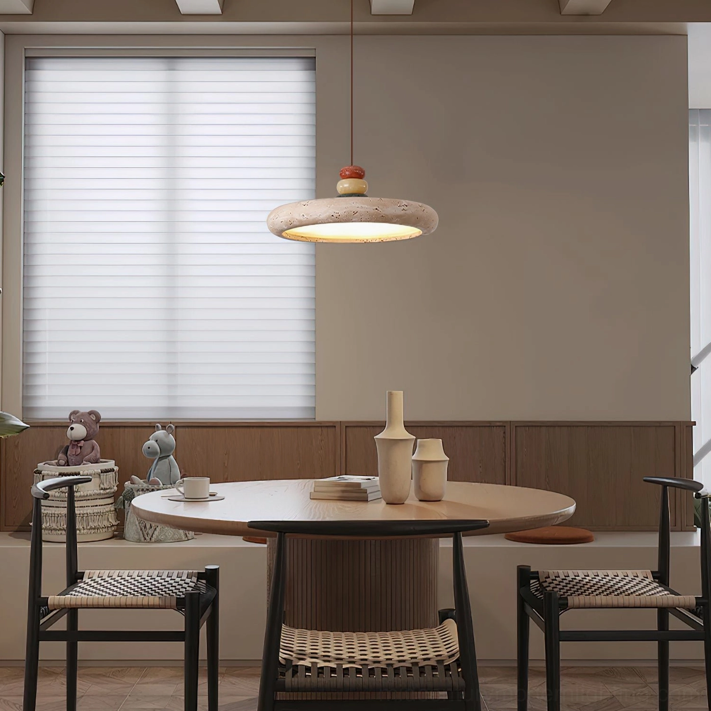 Modern travertine pendant lighting in contemporary dining room with woven seat chairs - eye level view