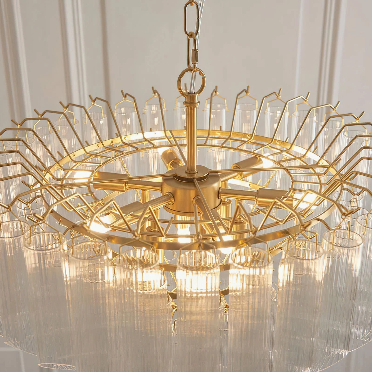 Astoria Waterfall Glass Chandelier internal structure - exposed brass frame with warm glowing LED illumination