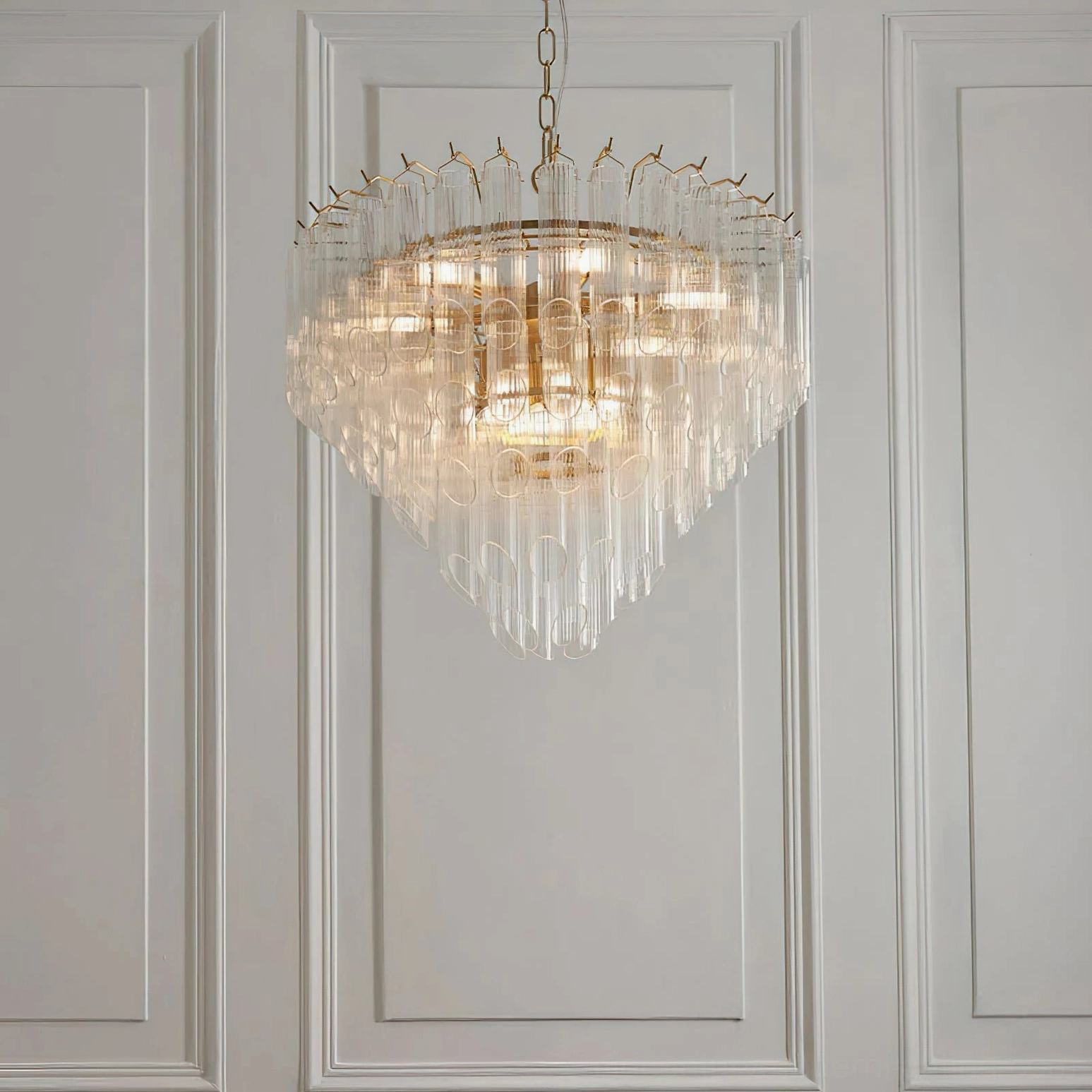 Astoria Waterfall Glass Chandelier side profile - symmetric tiered design with round brass frame on paneled interior