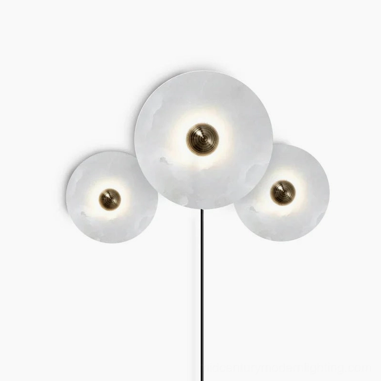 Asymmetrical three-lamp alabaster sconce with two smaller and one larger translucent stone disc