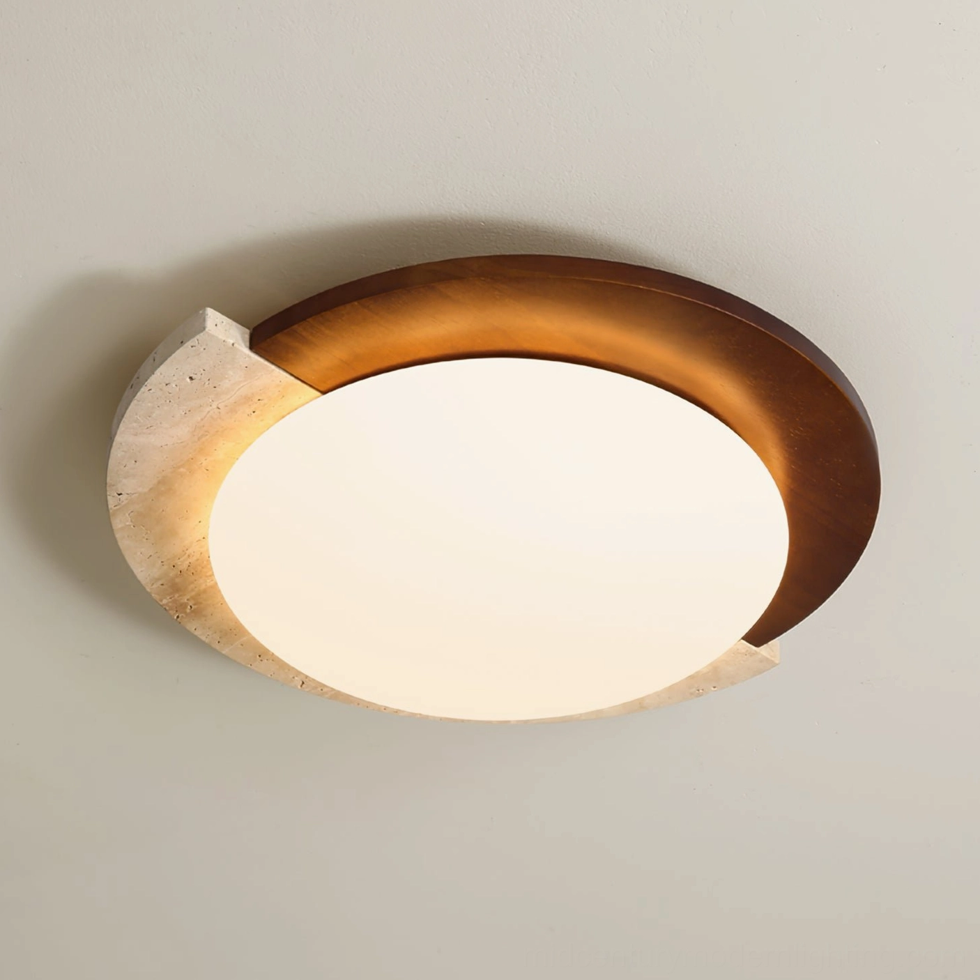 Close-up eye-level view of asymmetrical ceiling lamp mounted on beige wall showing walnut wood and travertine details