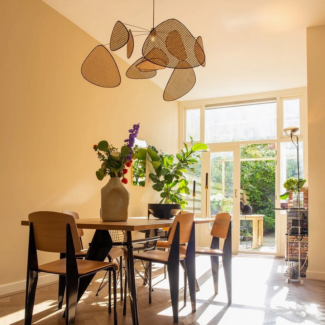 Asymmetrical rattan pendant shade arrangement, close-up detail of perforated bamboo weave pattern