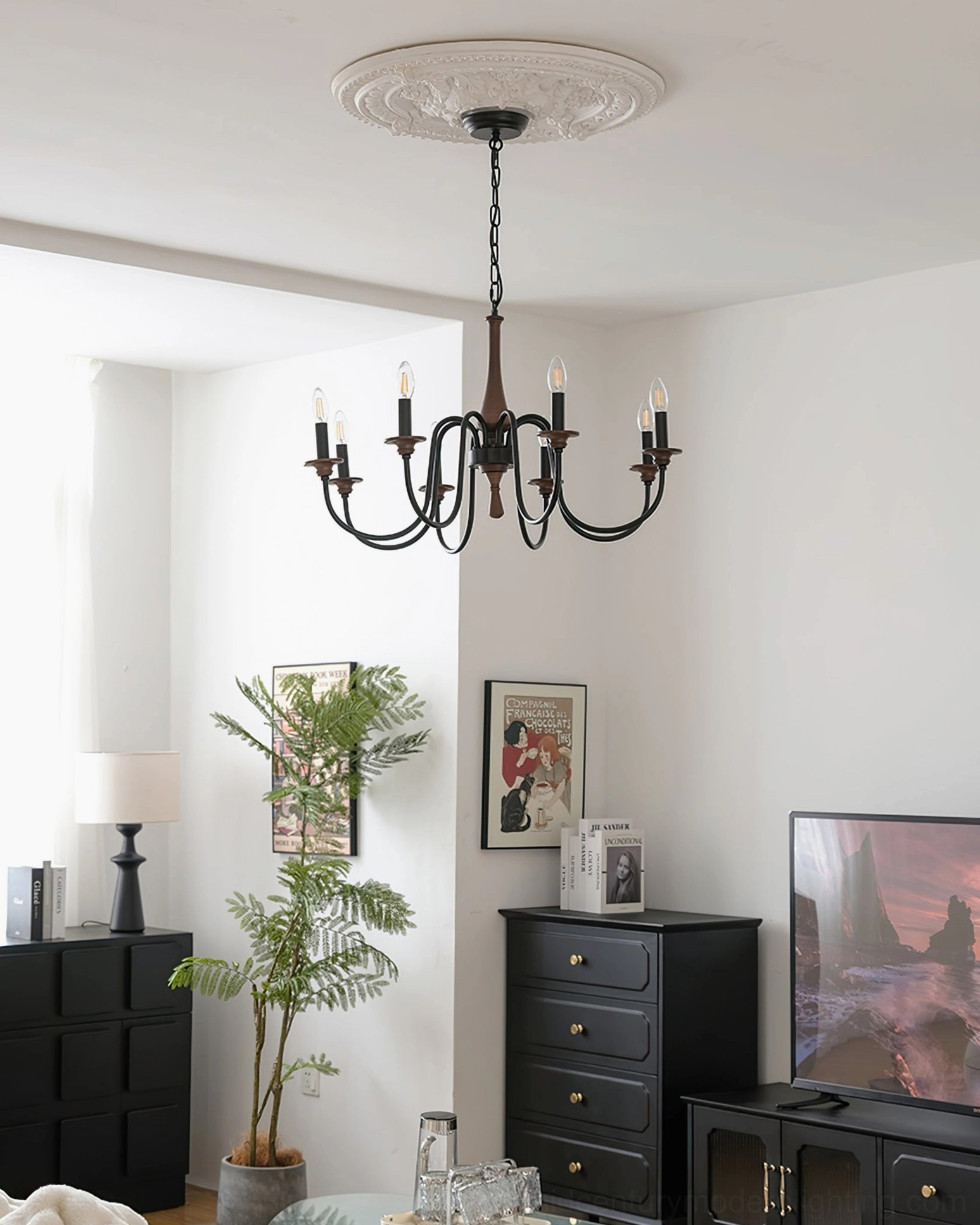 Aubrey 8-arm chandelier with warm LED candle lighting in retro home living room setting