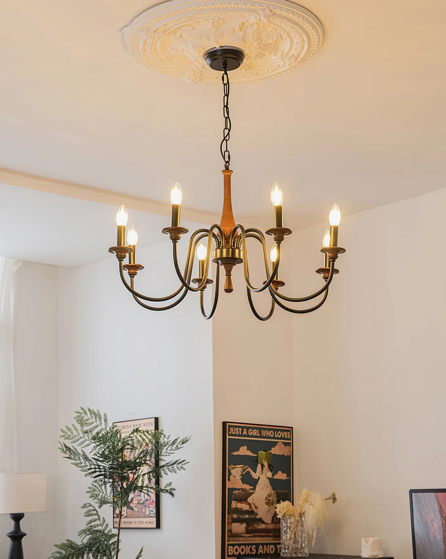Aubrey mid-century modern chandelier in cozy retro home with glowing warm candle bulbs and eye-level interior view