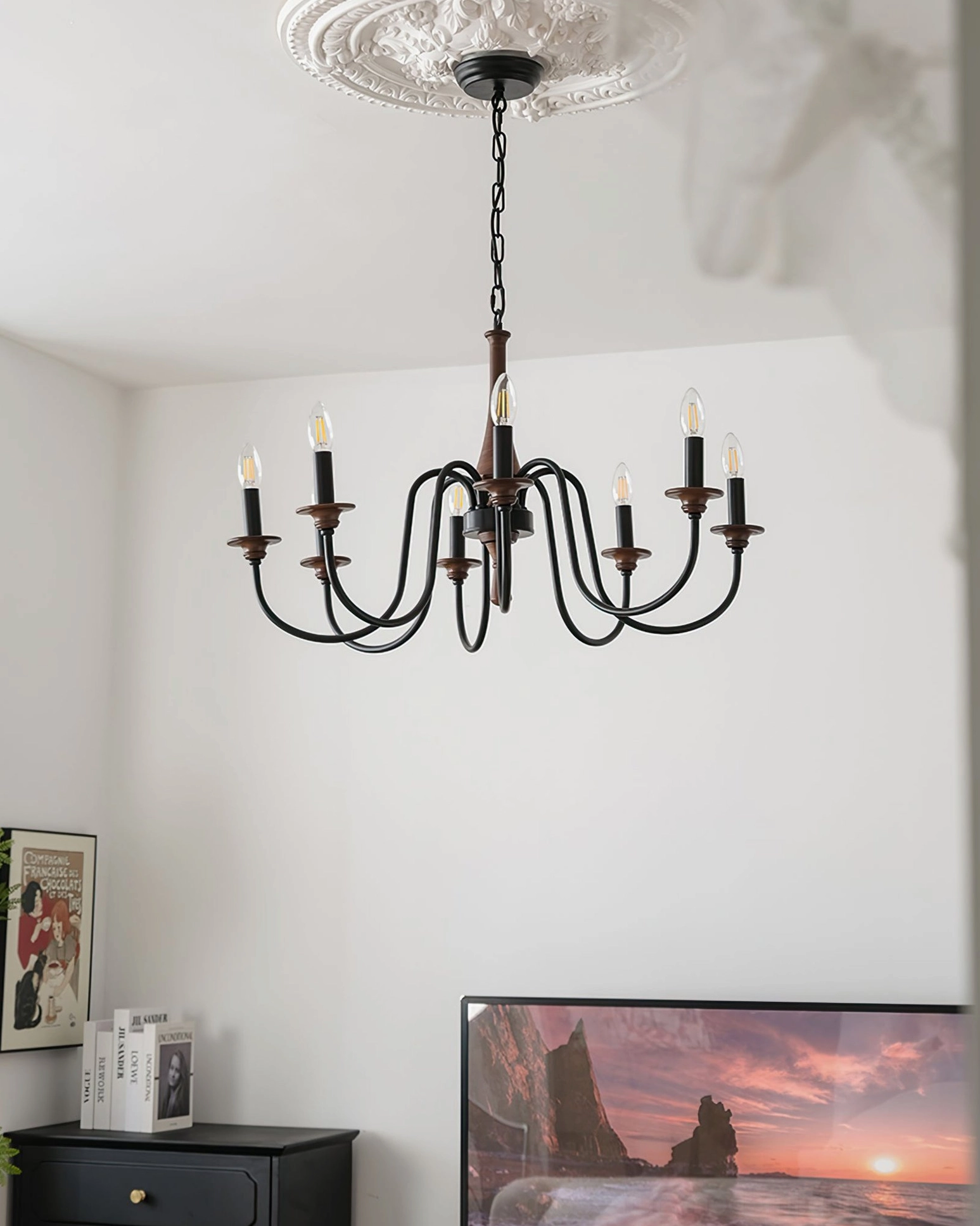 Minimalist black Aubrey chandelier in empty contemporary living room with sleek metal frame and no decorative accents