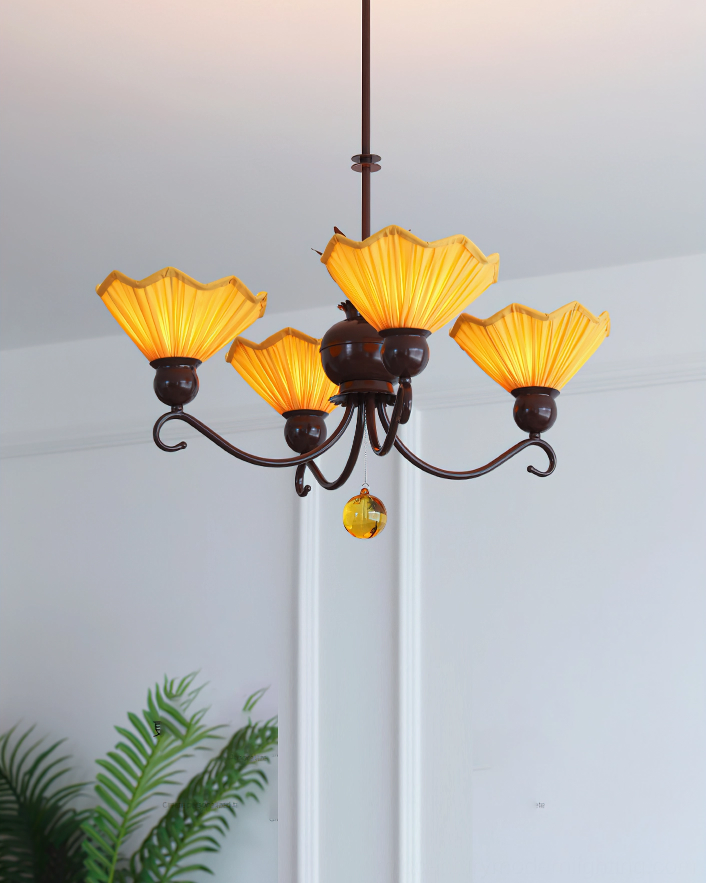 Aurelia 4-light pleated chandelier with dark brown metal frame and amber glass pendants in white interior with green foliage