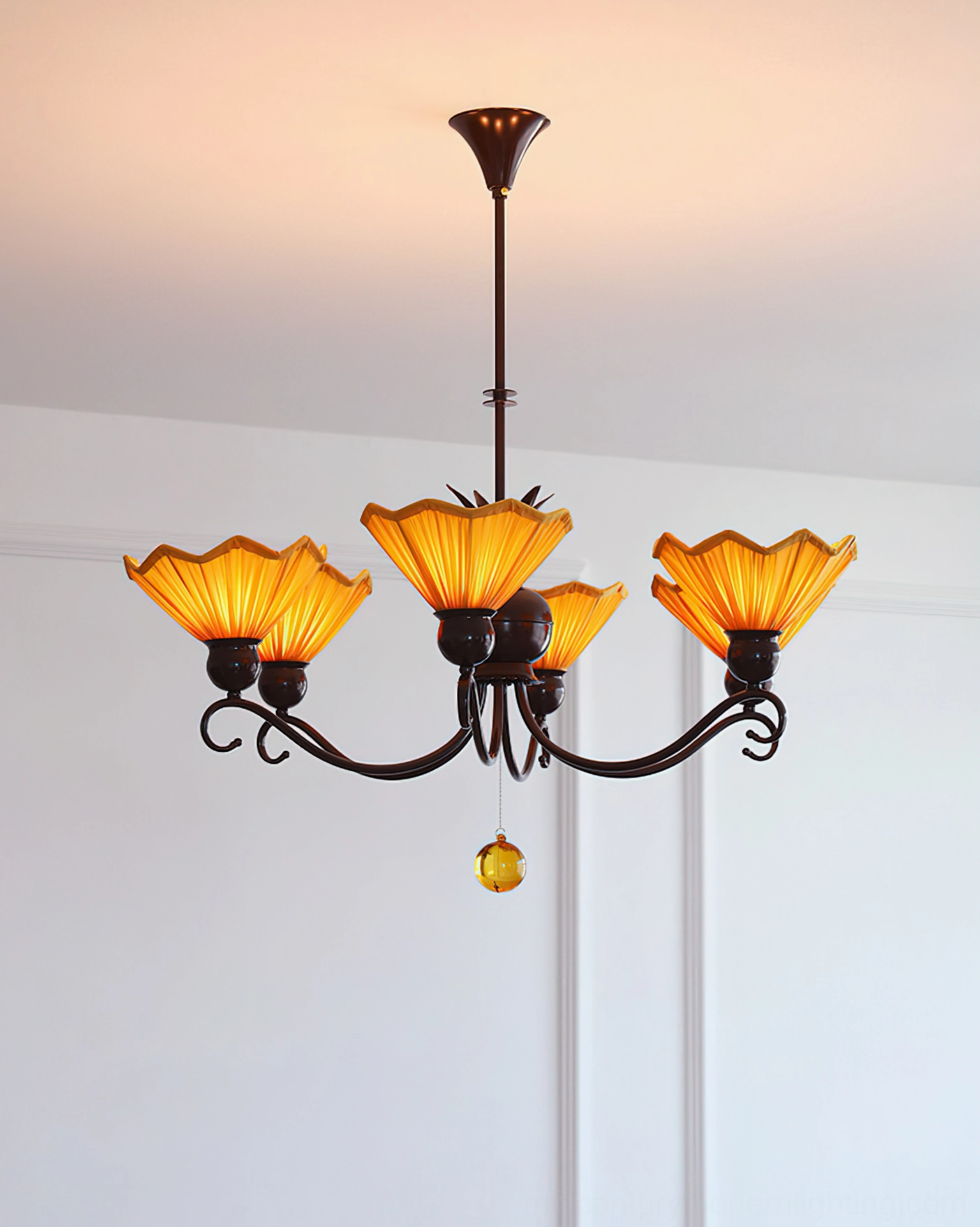 Aurelia 4-light pleated chandelier featuring symmetrical scrollwork metal arms and warm amber lighting shades