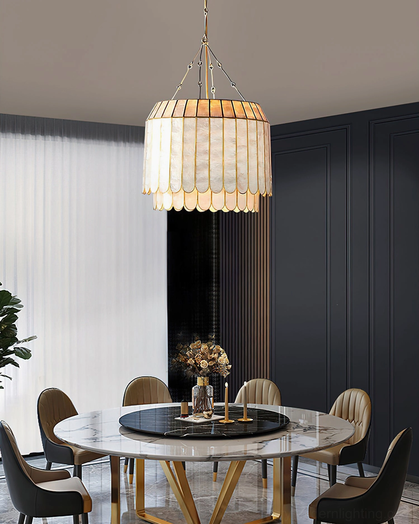 Capiz shell pendant lamp detail shot highlighting hand-cut scalloped shell pattern, pearlescent finish, and warm light diffusion effect