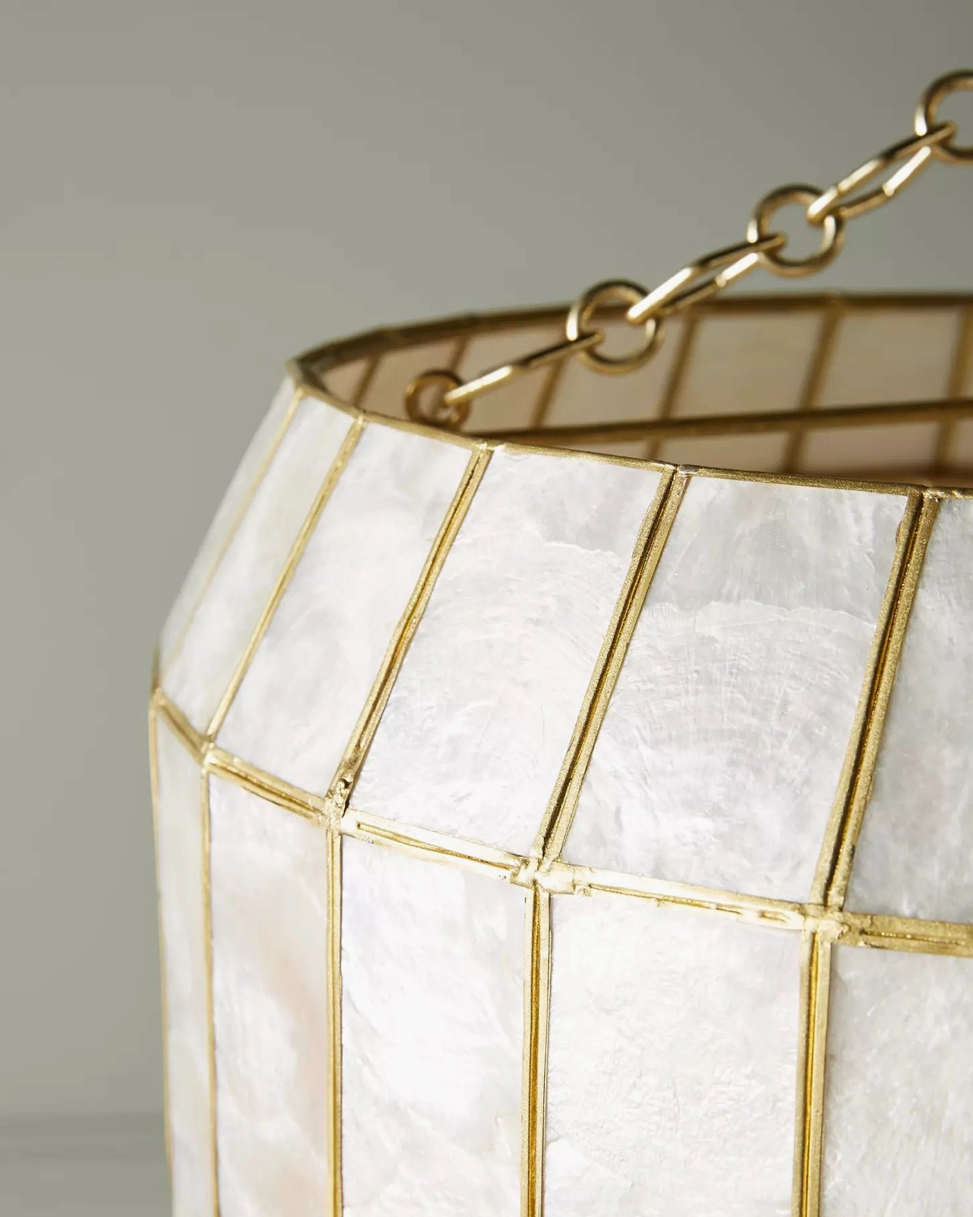 Capiz shell pendant lamp multi-view composition showing different angles and sizes available for coastal glam lighting design inspiration