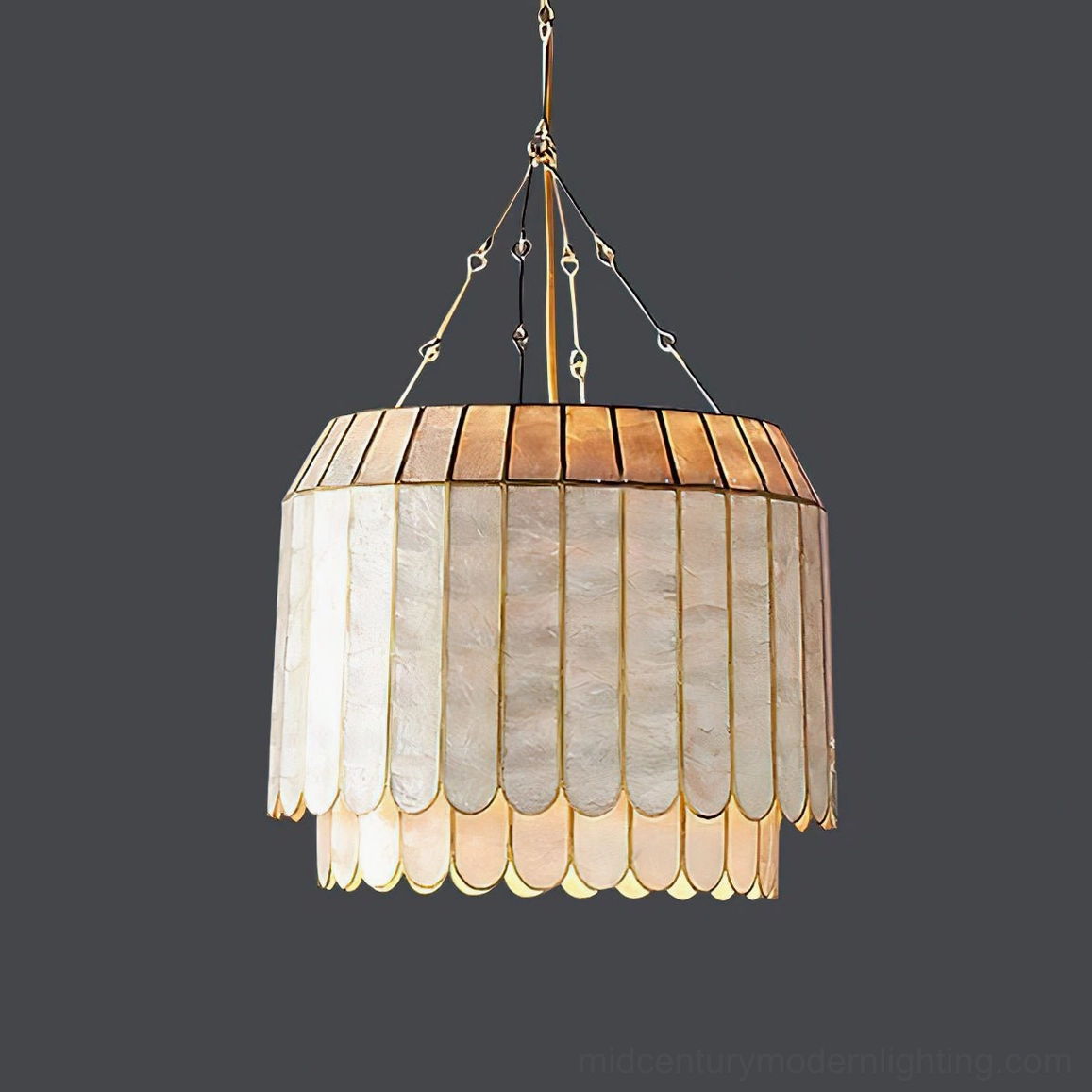 Single-tier capiz shell lamp with warm gold frame against neutral background, minimal luxury design, translucent pearl finish