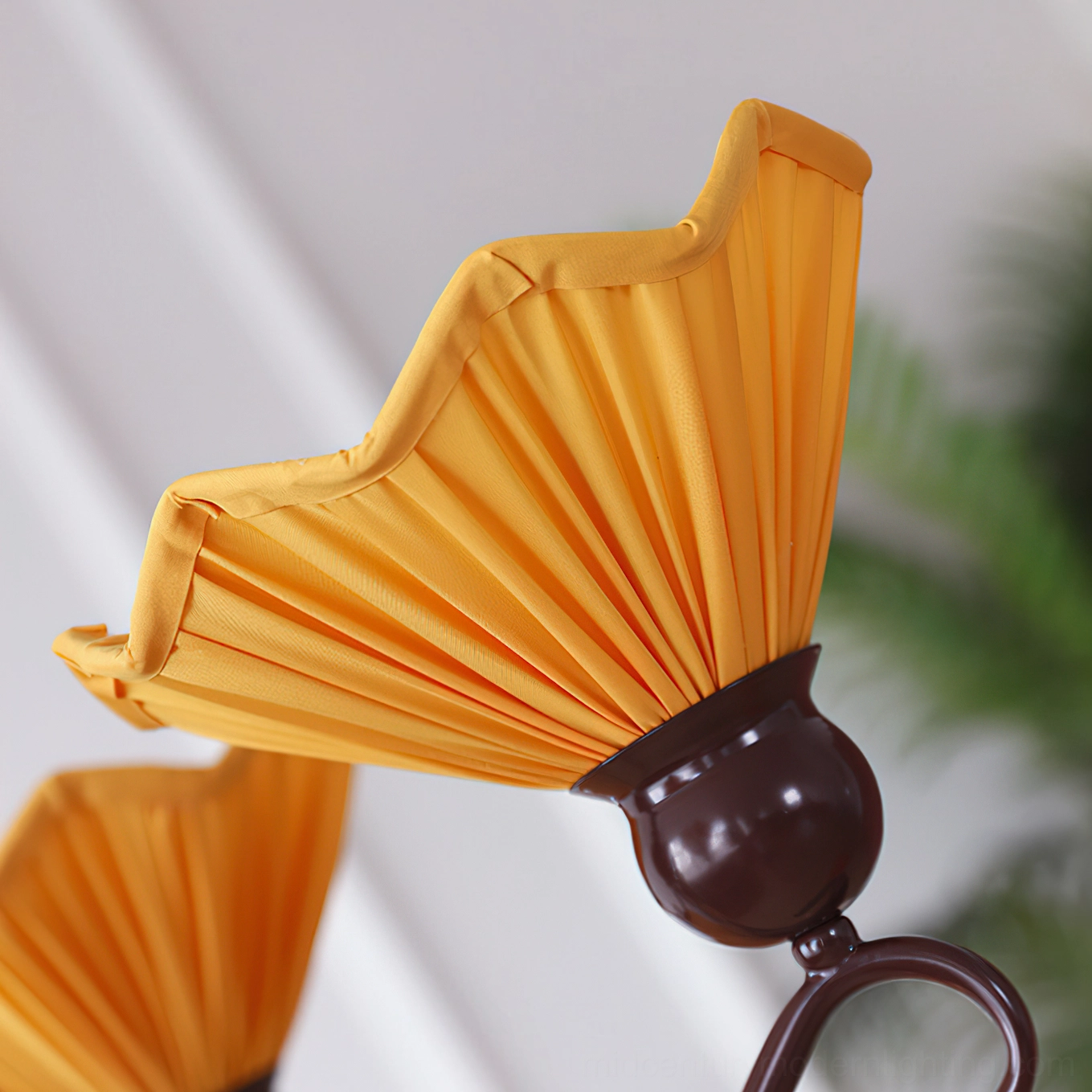 Aurelia pleated chandelier installation showing suspension rod and mounting hardware assembly