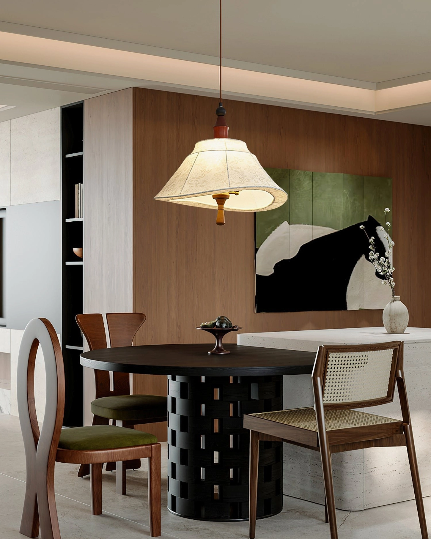 Mid-century modern pendant light in contemporary kitchen dining area with brass accents and warm decorative glow