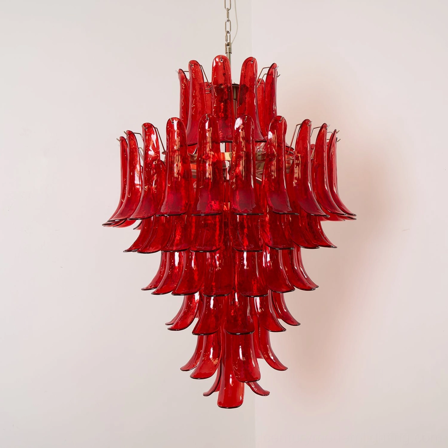 Murano glass chandelier featuring authentic hand-blown crimson glass petals suspended from gold metal framework, artistic mid-century design
