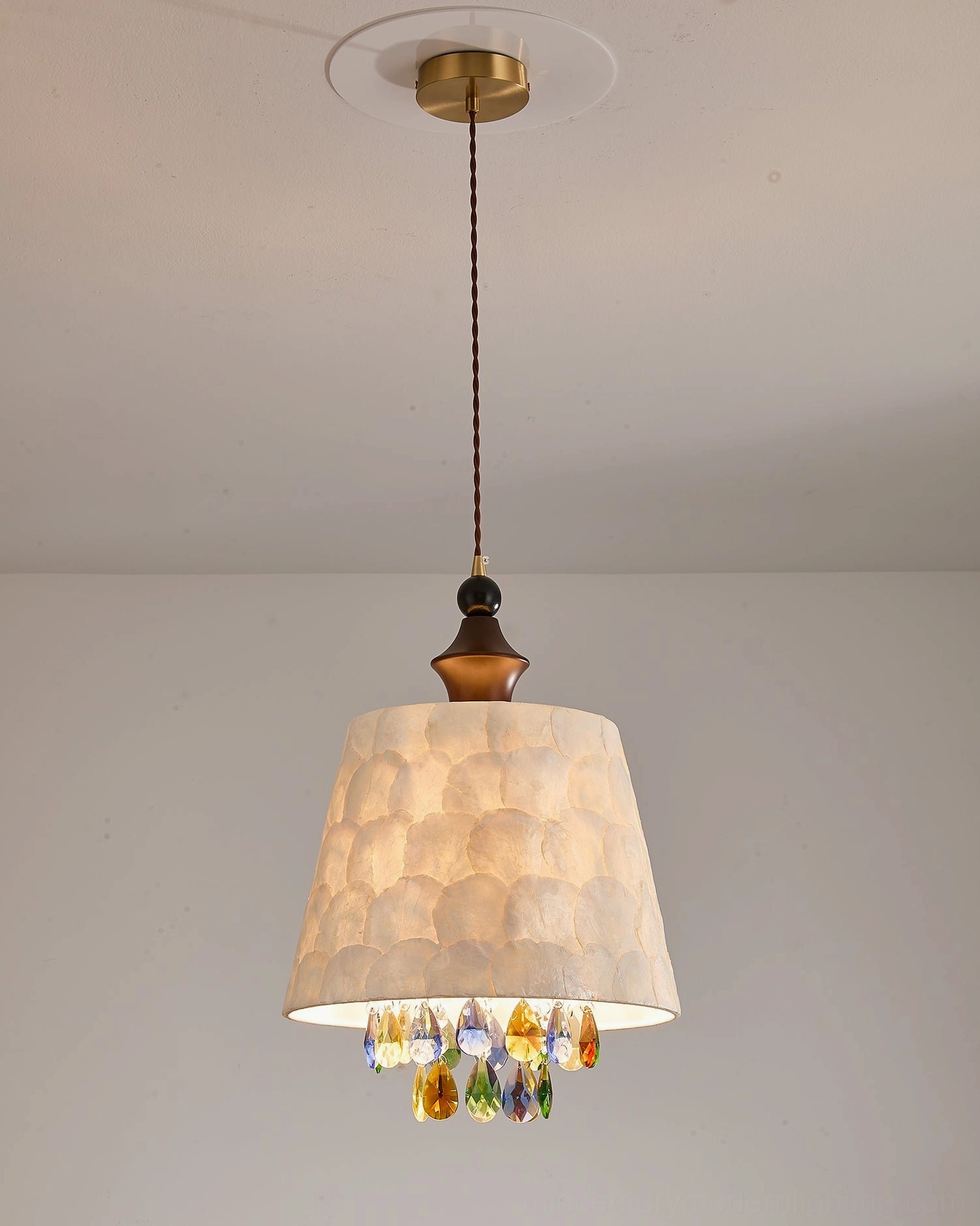 Avery capiz shell pendant lamp showing natural shell layers and iridescent shimmer with faceted crystal fringe detail