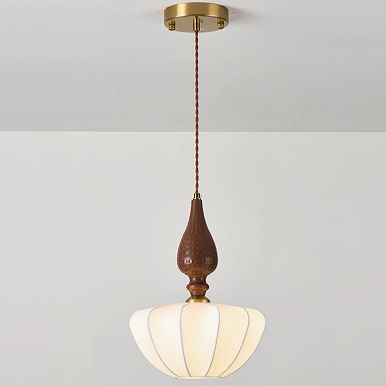 Wide-bodied fabric pendant light with brass ceiling plate, twisted brown cord, and dark wood gourd stem