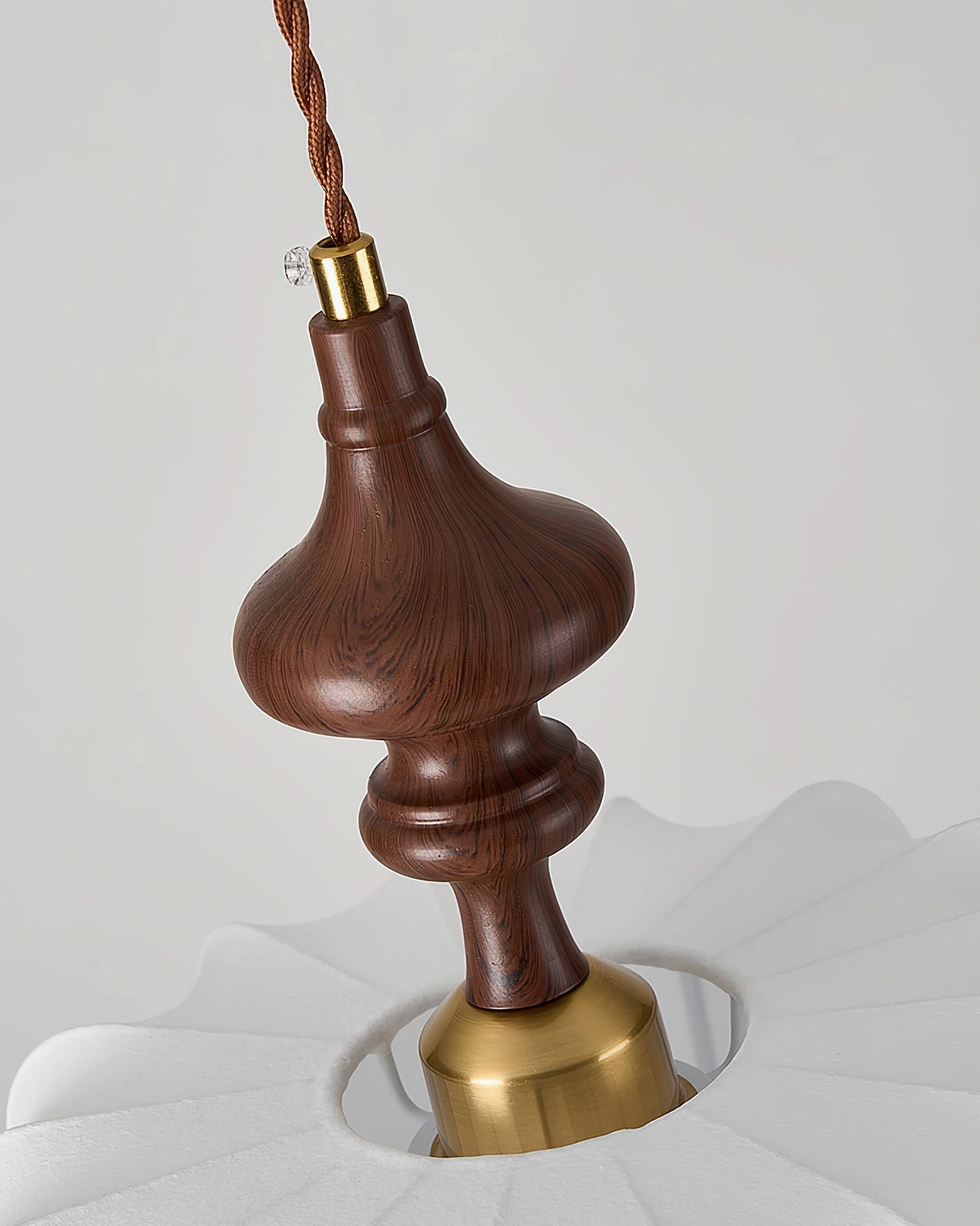 Baird mid-century pendant light architectural detail showing brass mounting hardware and wood stem connection