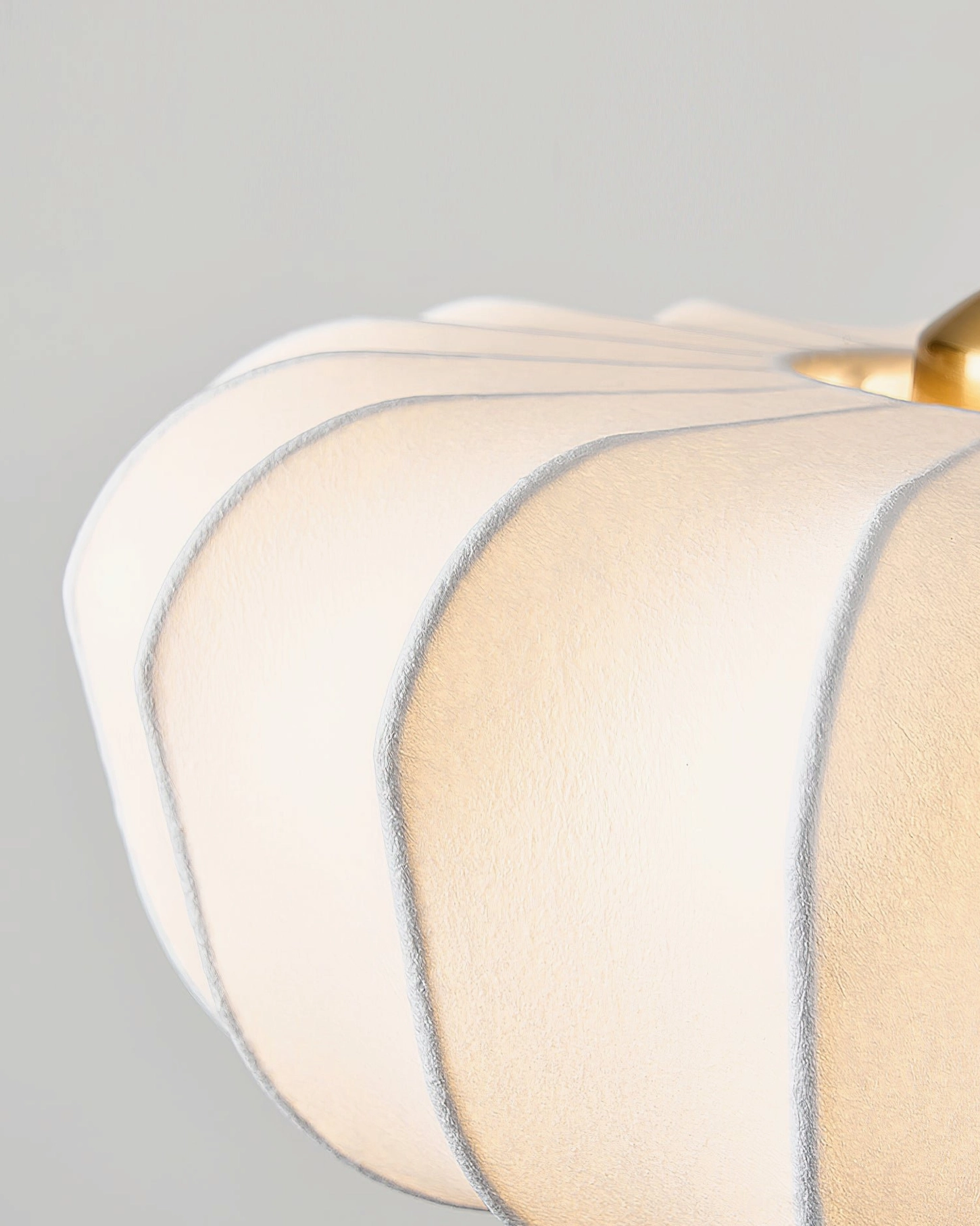 Mid-century modern pumpkin pendant light side profile showcasing sculptural design and wood grain detail