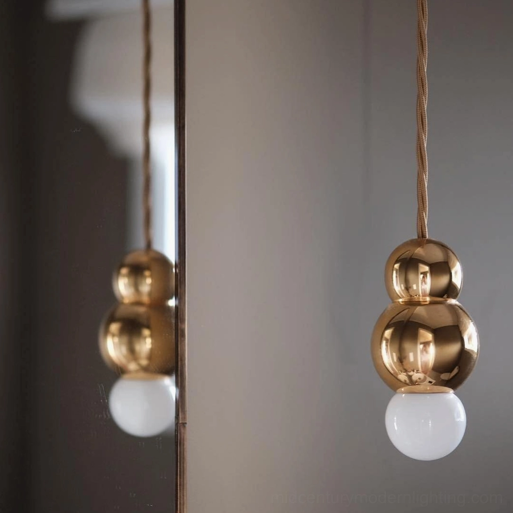 Ball pendant light with frosted diffuser and warm light emission, contemporary lighting ambiance demonstration
