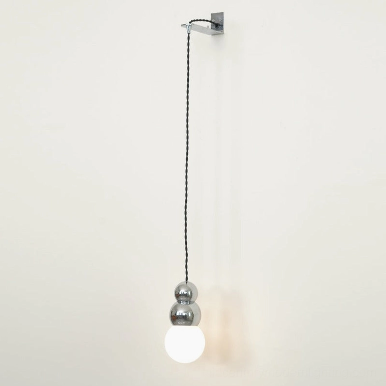 Ball wall light in contemporary home setting, functional design art piece, modern pendant display