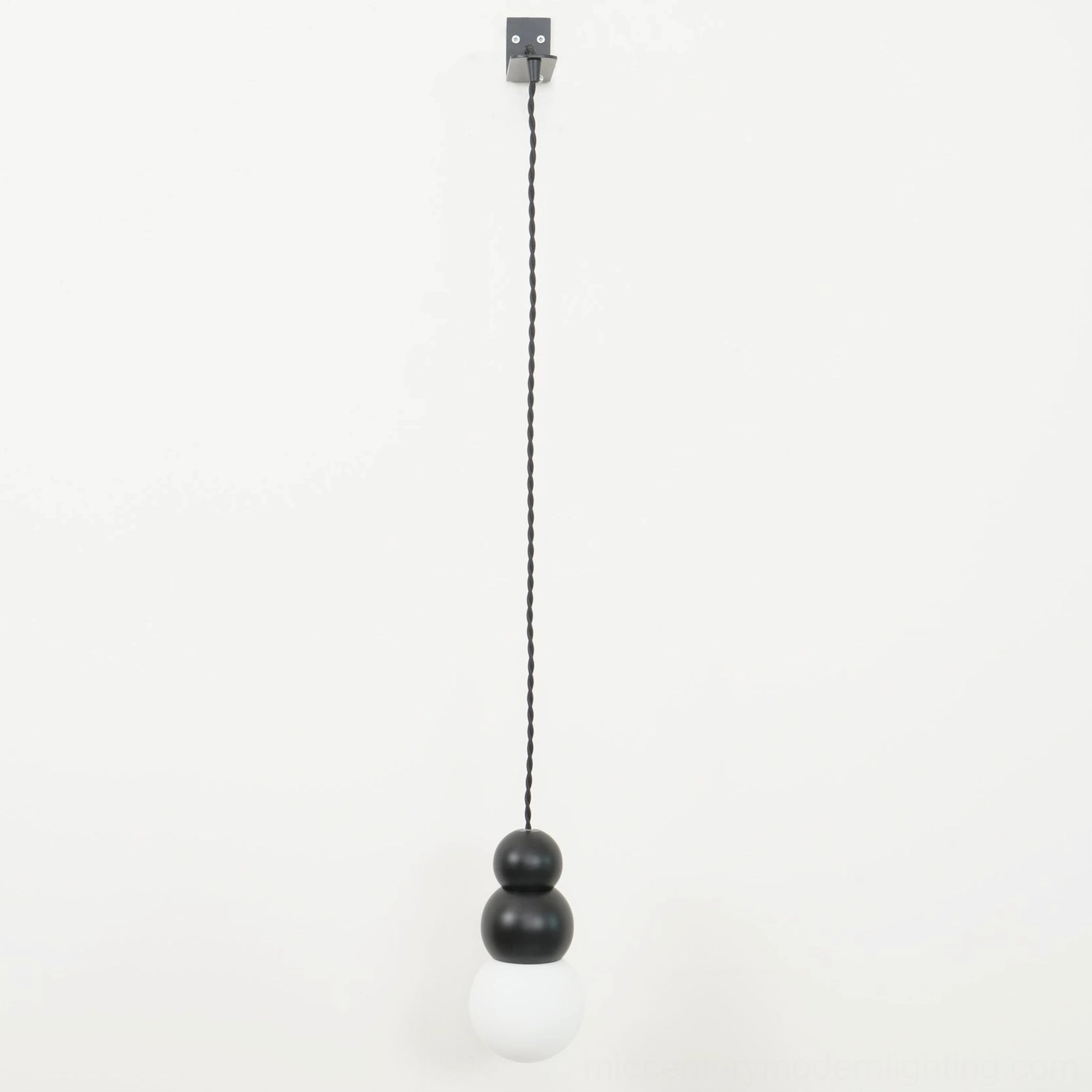 Ball wall sconce installation in living room, accent lighting solution, interior design feature