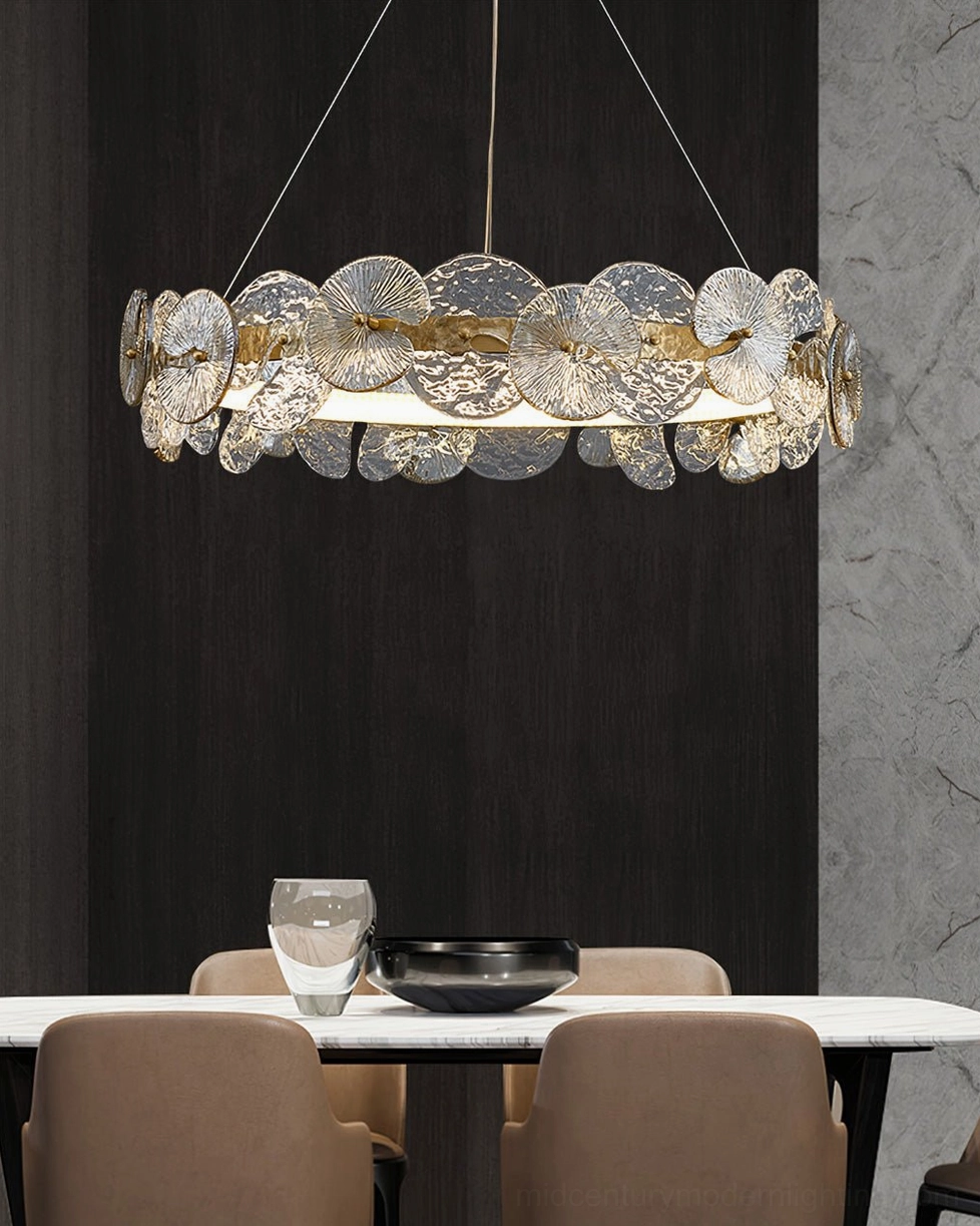 Barclay gold-trimmed chandelier above modern dining space with dark wood accent wall