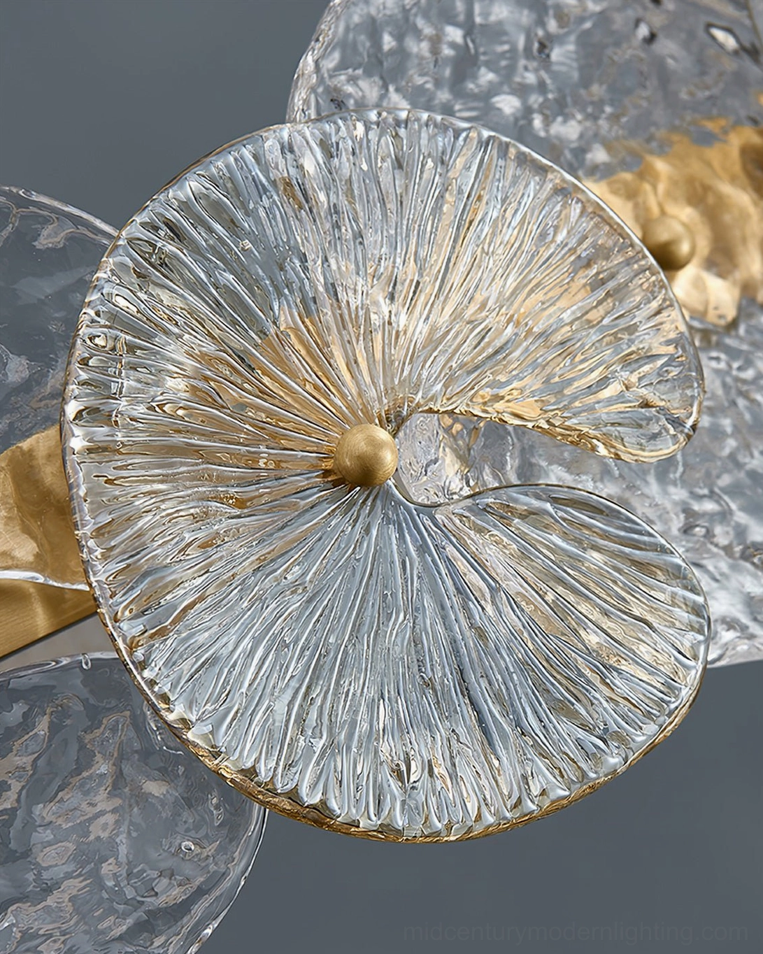 Close-up macro detail of Barclay lotus-petal textured glass with gold metal center accent