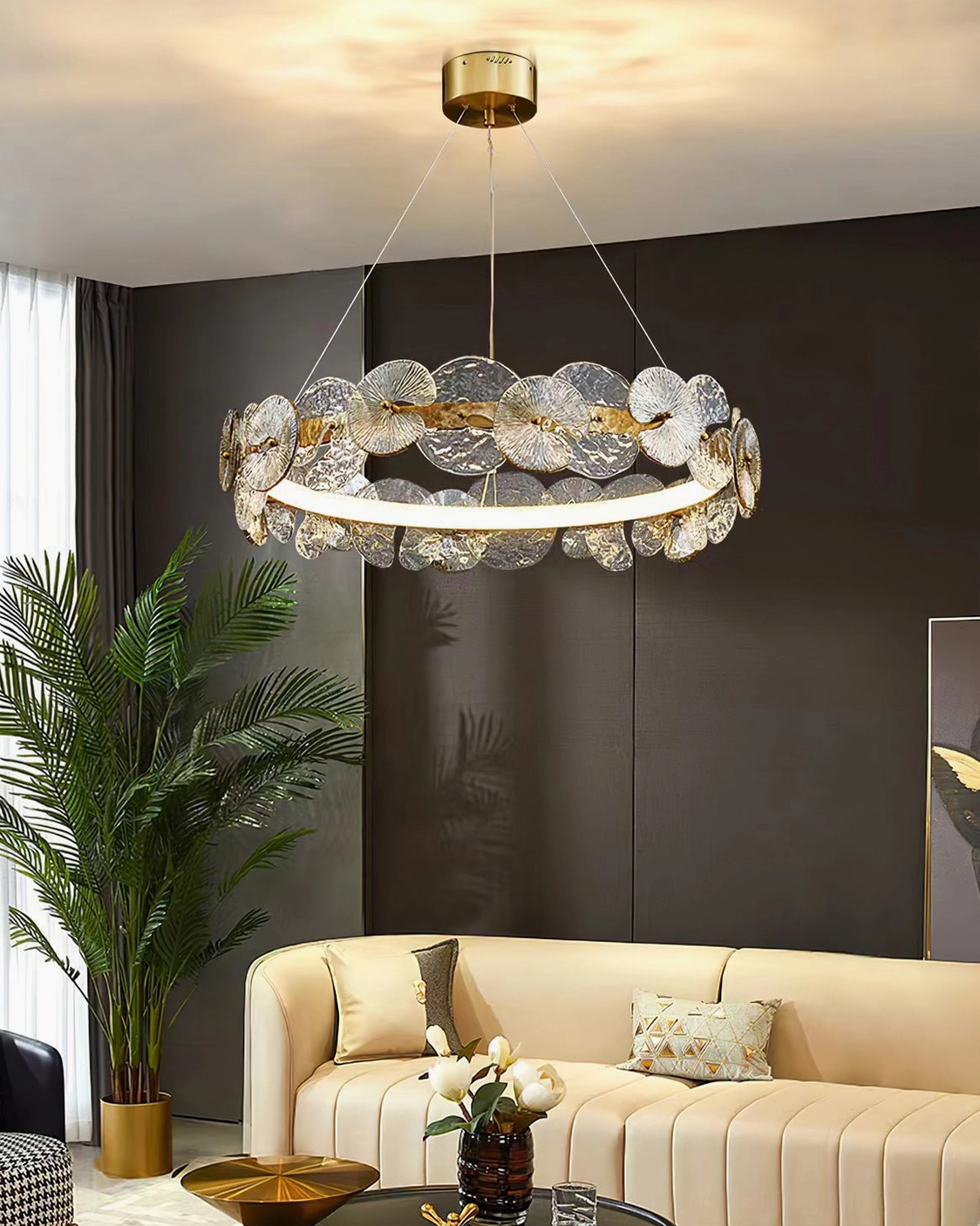 Barclay chandelier installed in modern living room with beige sofa and contemporary furniture