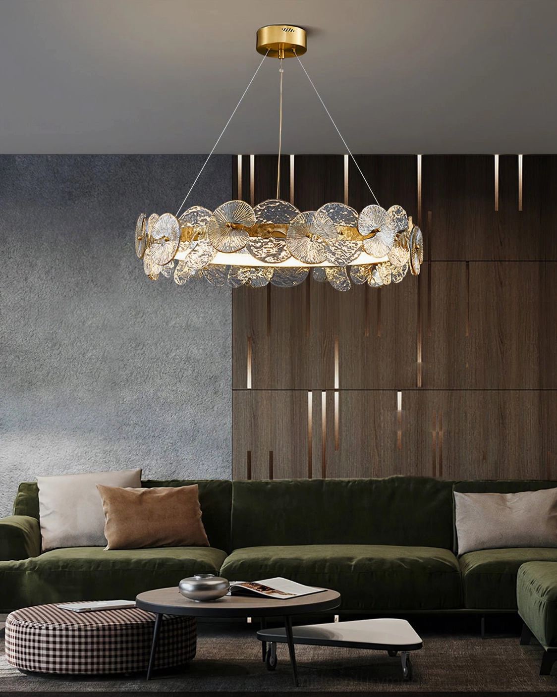 Barclay glass chandelier above dark green velvet sofa in contemporary luxury living space