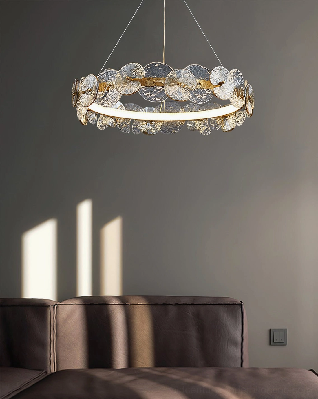 Barclay chandelier overhead lighting in modern living room with brown leather furnishings