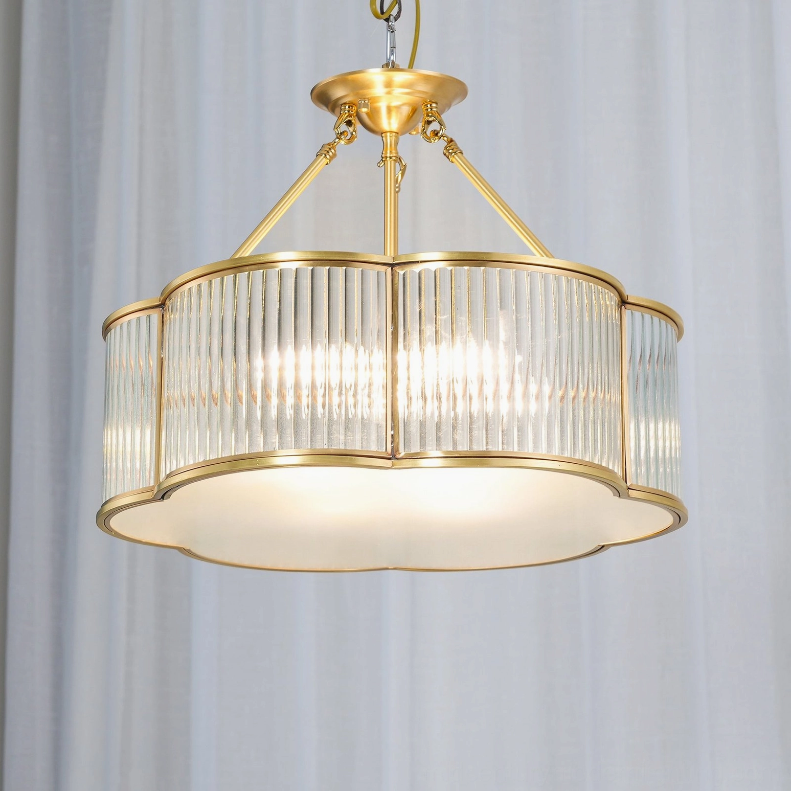 Quatrefoil chandelier in ambient room lighting showing soft light distribution from frosted diffuser
