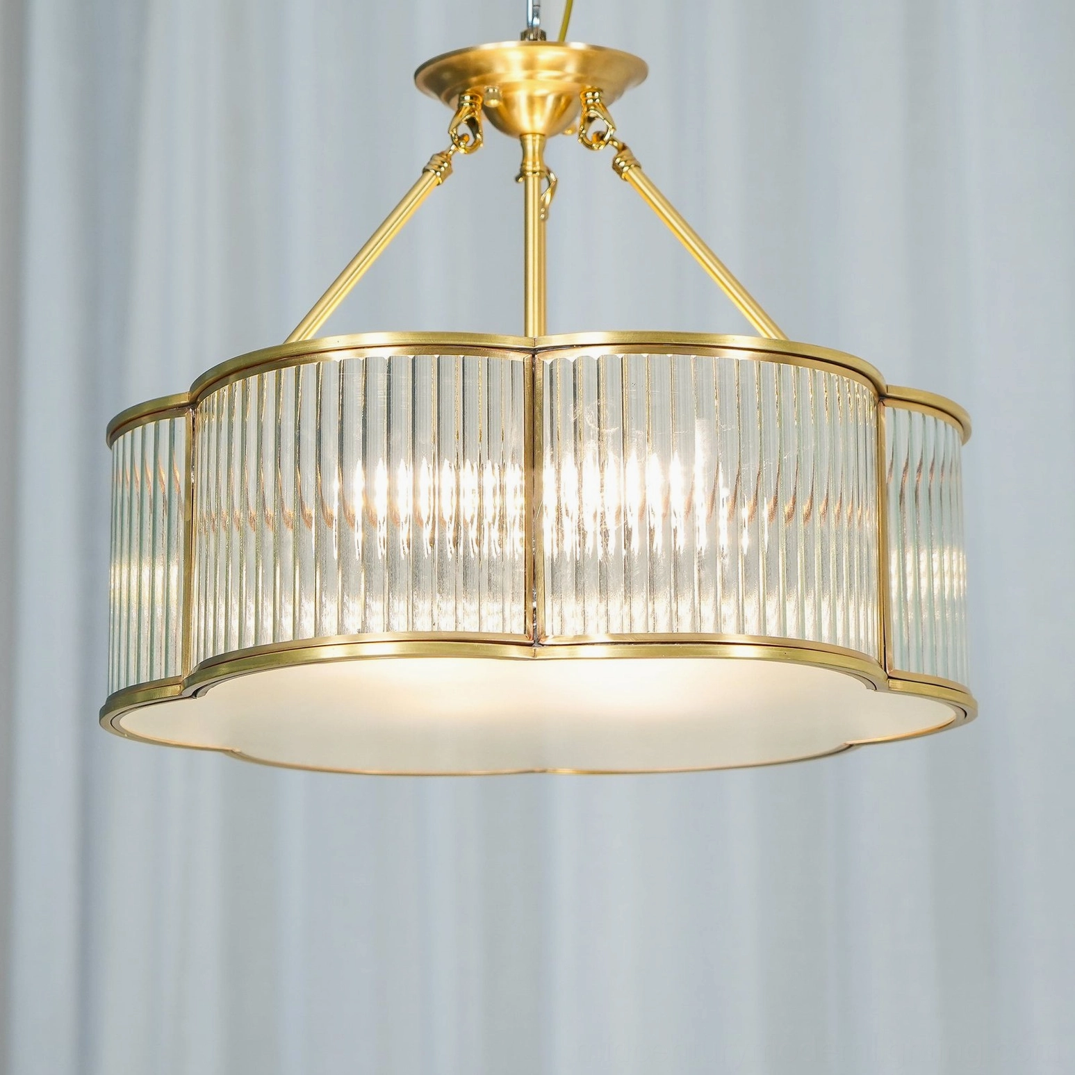 Quatrefoil chandelier interior glass shade showing bulb visibility and ribbed refraction pattern