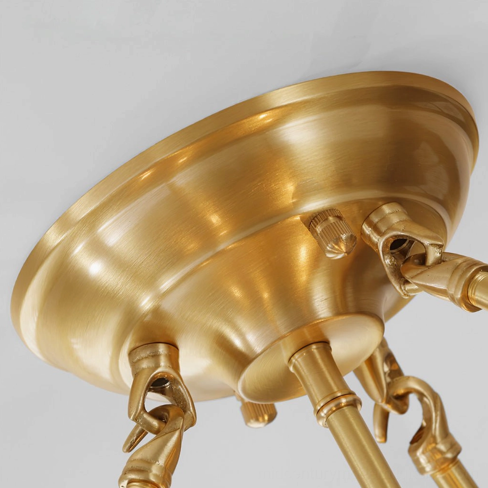 Polished brass quatrefoil chandelier with clear ribbed glass showing mid-century modern design