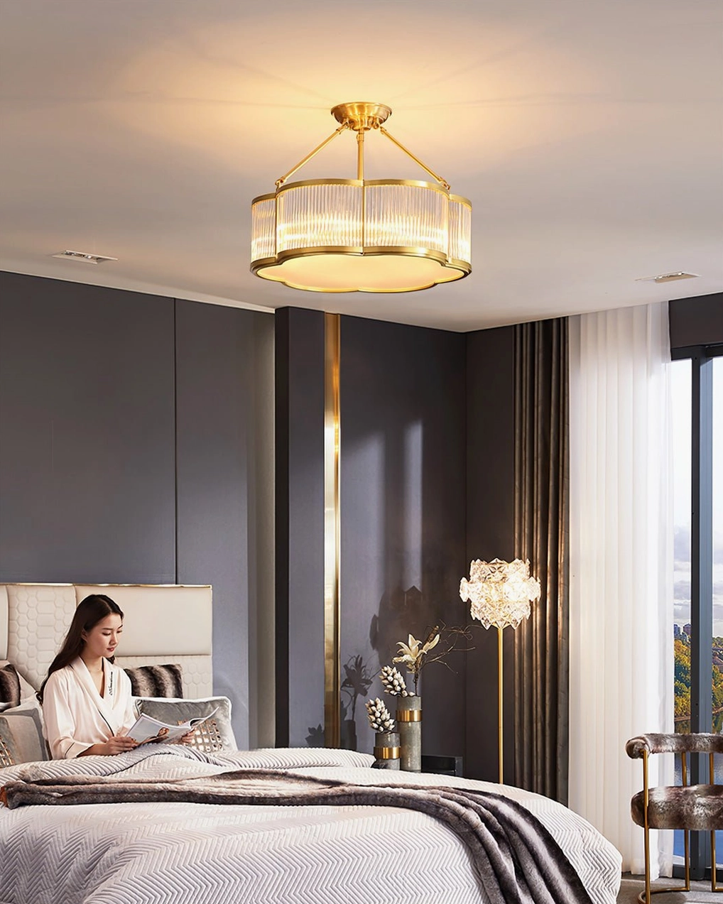 Basil quatrefoil chandelier showing vertical ribbing in clear glass shade with polished brass frame detail