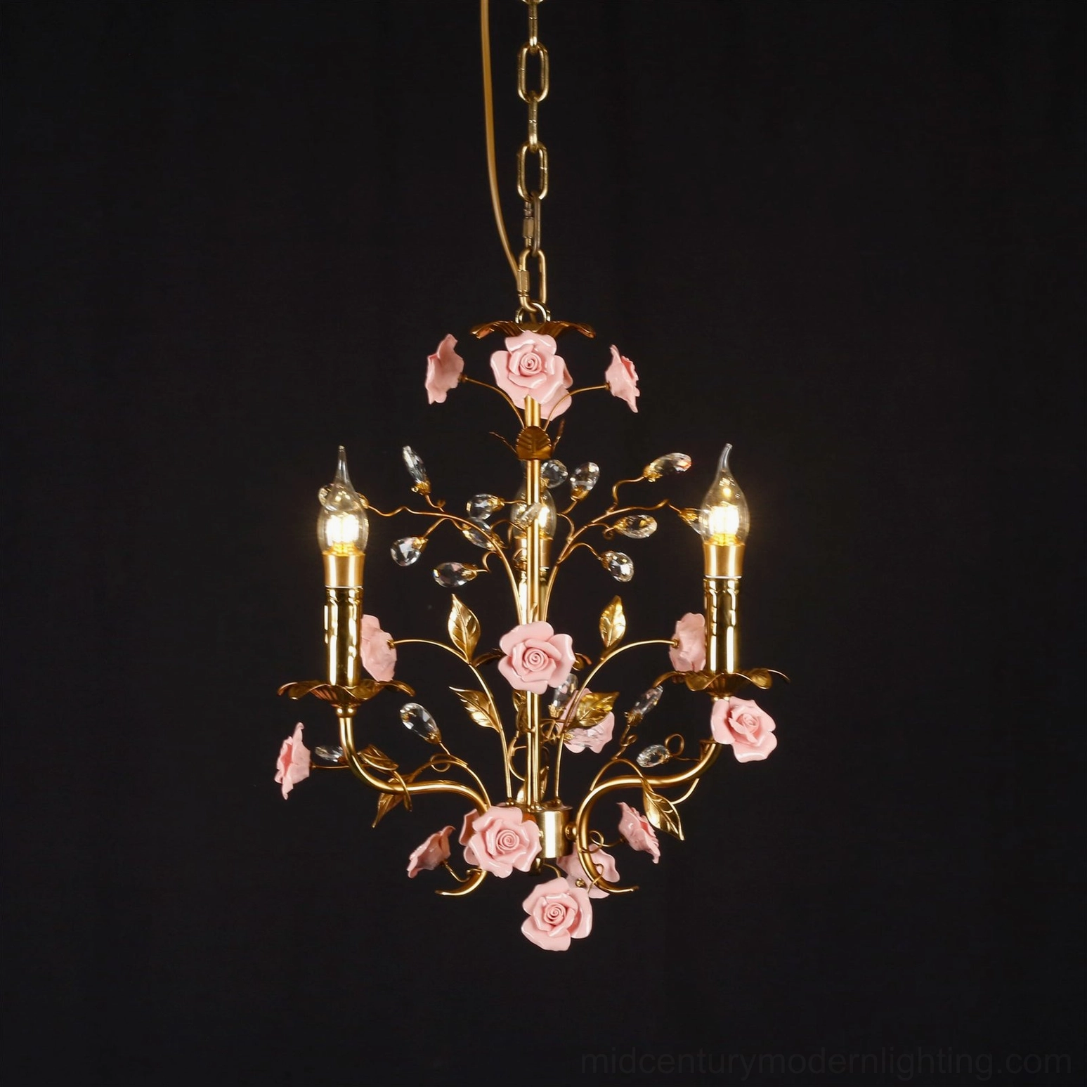 Bassano chandelier product lifestyle shot, brass frame with hand-painted pink ceramic roses pendant light