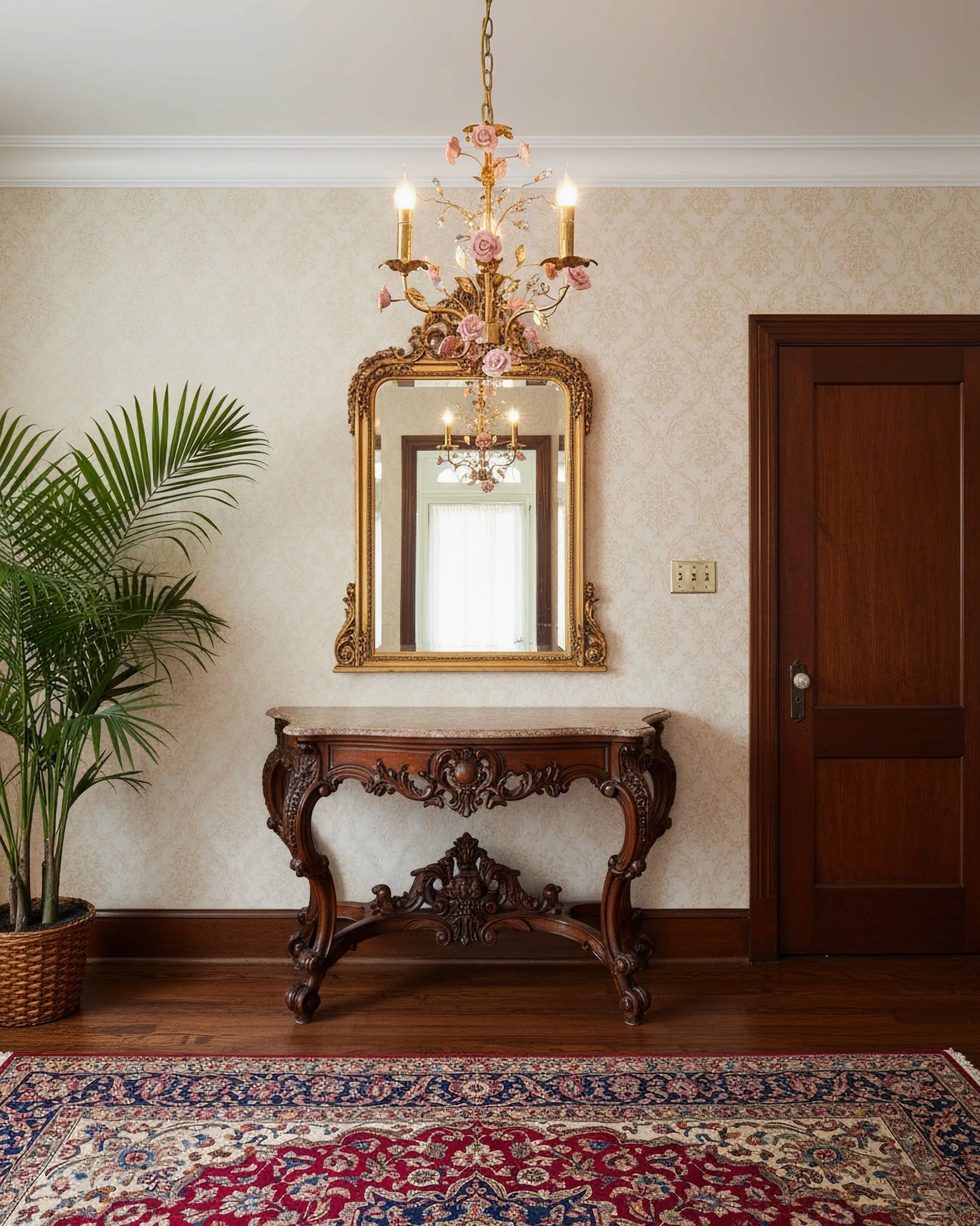 Bassano chandelier in neoclassical entryway with ornate furniture and gold mirror, elegant romantic lighting fixture